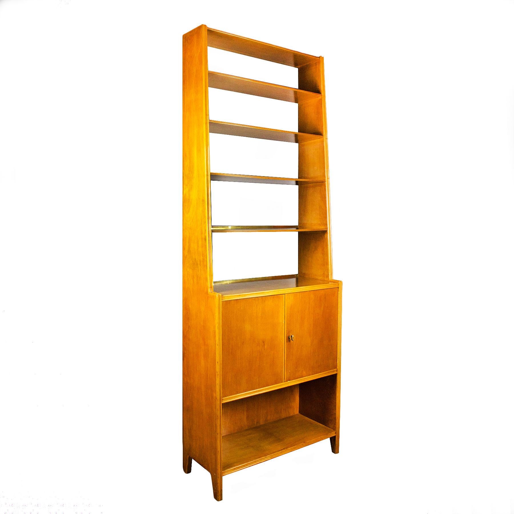 Bookcase, maple wood, French polished, two doors and five shelves, one shelf inside.

Italy, circa 1950.