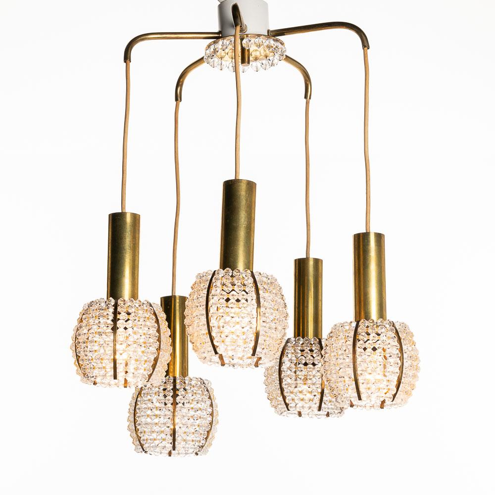 The acrylic beading and contrasting brass elements add an air of opulence to this beautiful light. We have more of the same style, different shapes, in stock. Also matching table lights. Cascade light by Emil Stejnar.