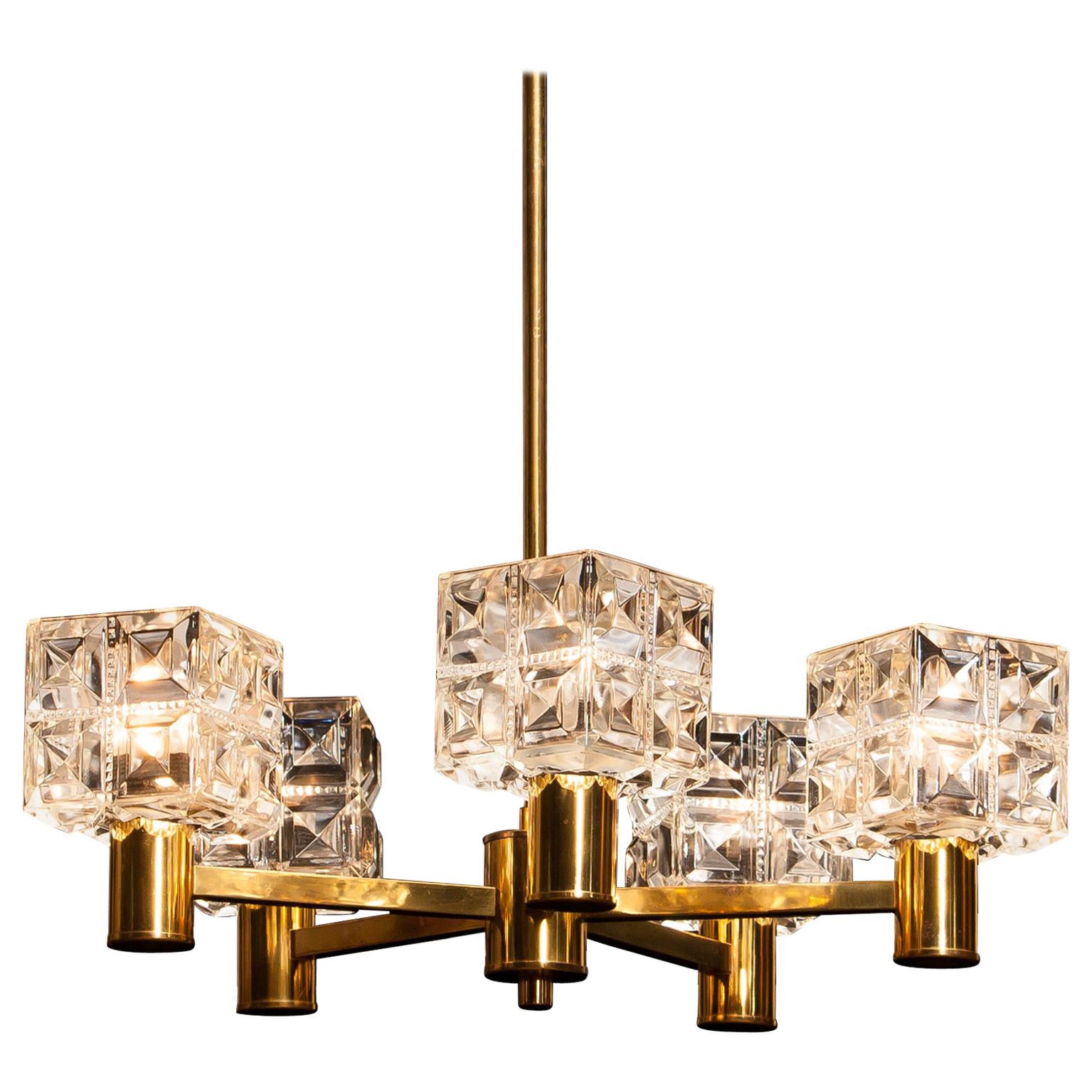 Beautiful chandelier made by Tyringe Konsthantverk, Sweden.
This lamp is made of five-brass arms with crystal shades.
It is in good condition.
Period: 1950s.
Dimensions: H 66 cm, Ø 54 cm.
 