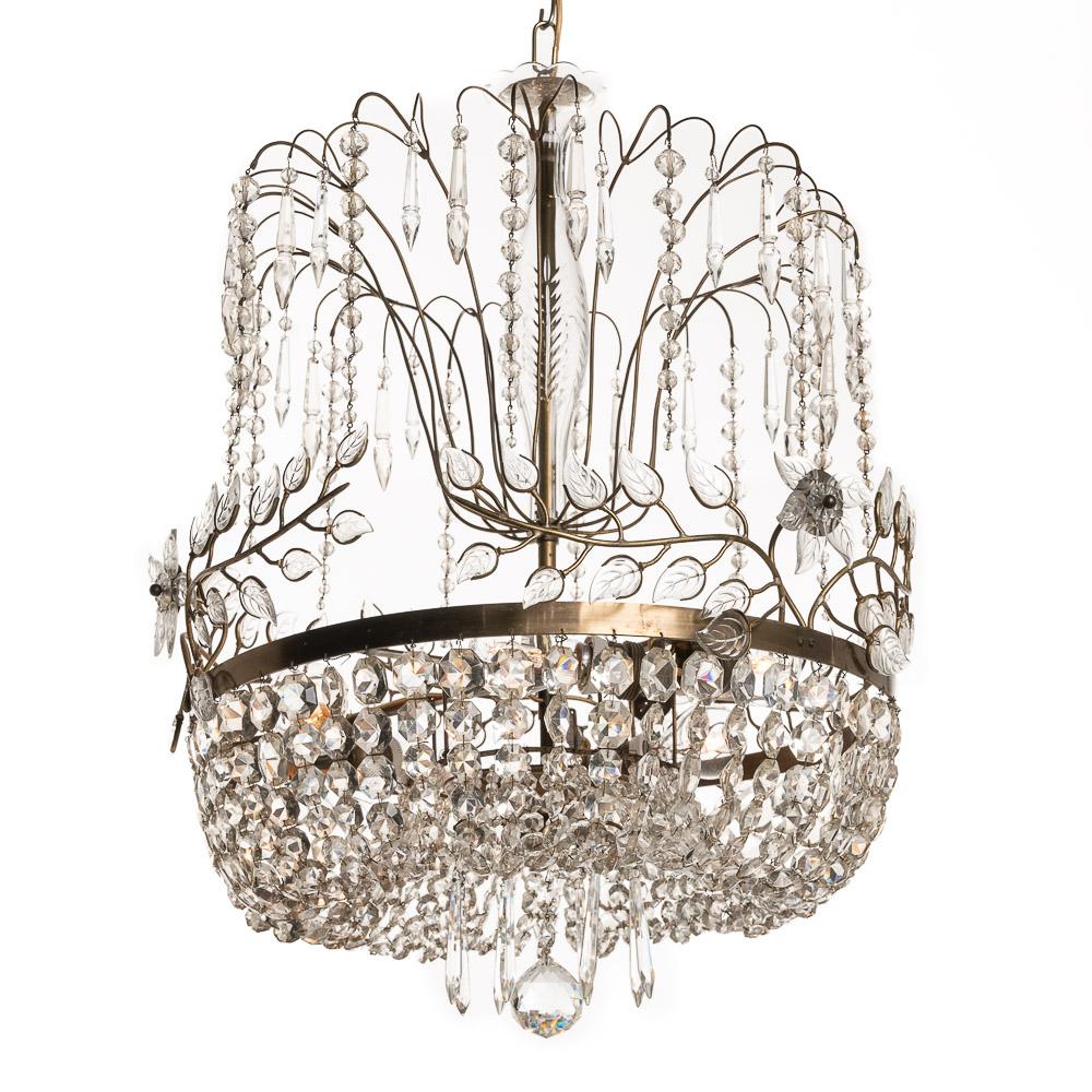 This is a standout piece The brilliant beading work in crystal glass gives an opulent yet elegant feel. It diffuses the light in a beautiful way with a prismatic and shimmering effect.
It also has decorative waterfall design work on the