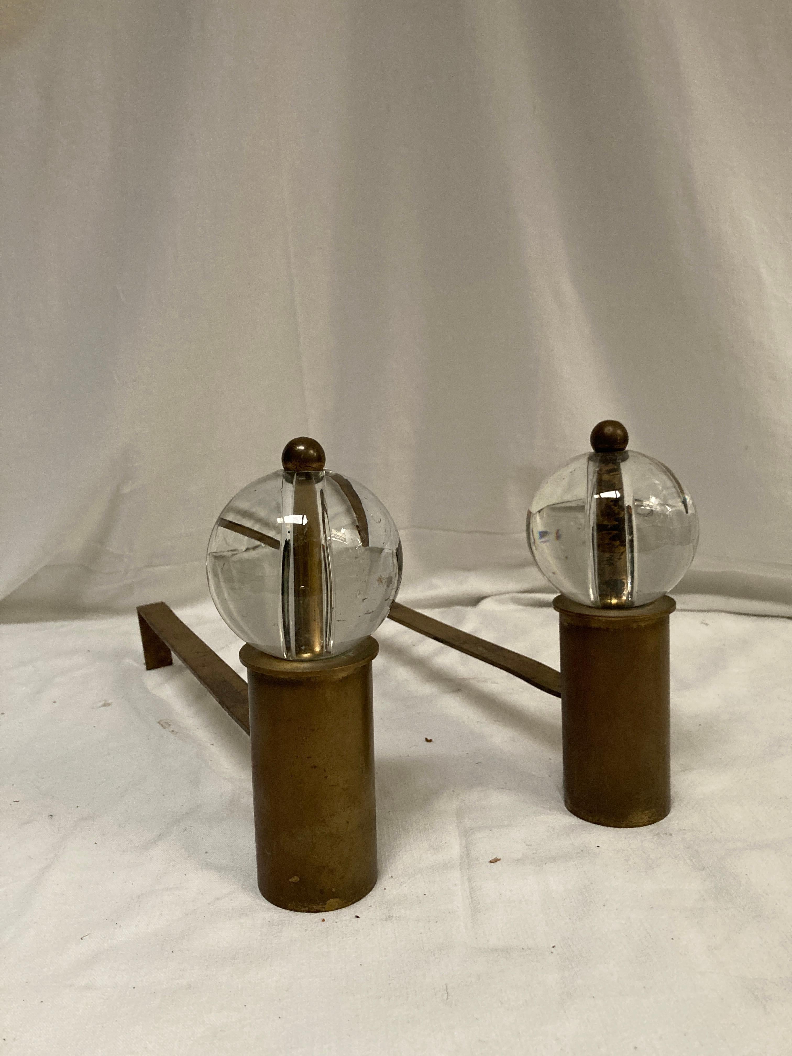 1950's Brass and glass balls andirons in the style of Jacques Adnet
France
One little chip in the bottom of one ball who doesn't affect anything

