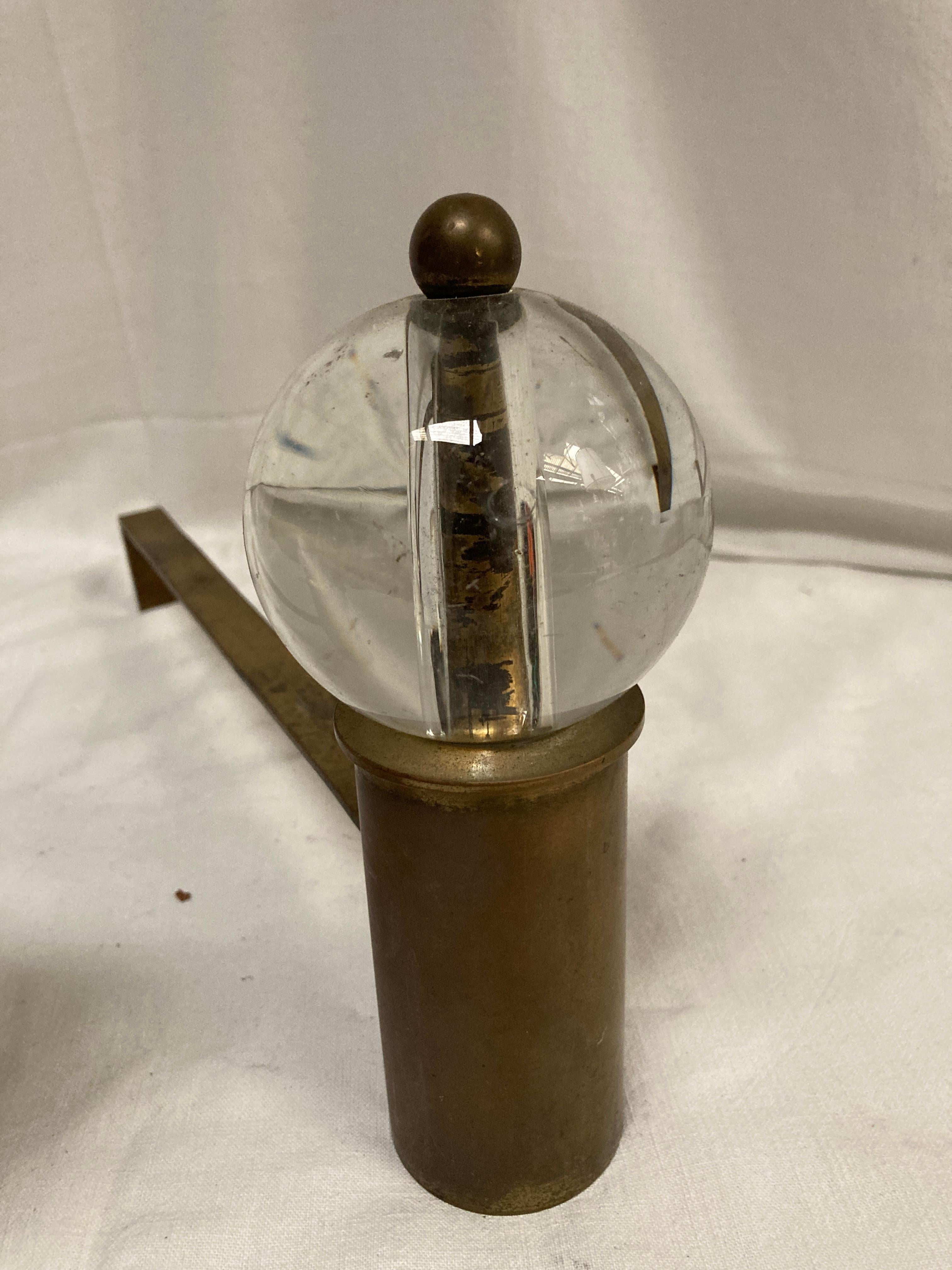 French 1950's Brass and glass andirons in the style of Jacques Adnet For Sale