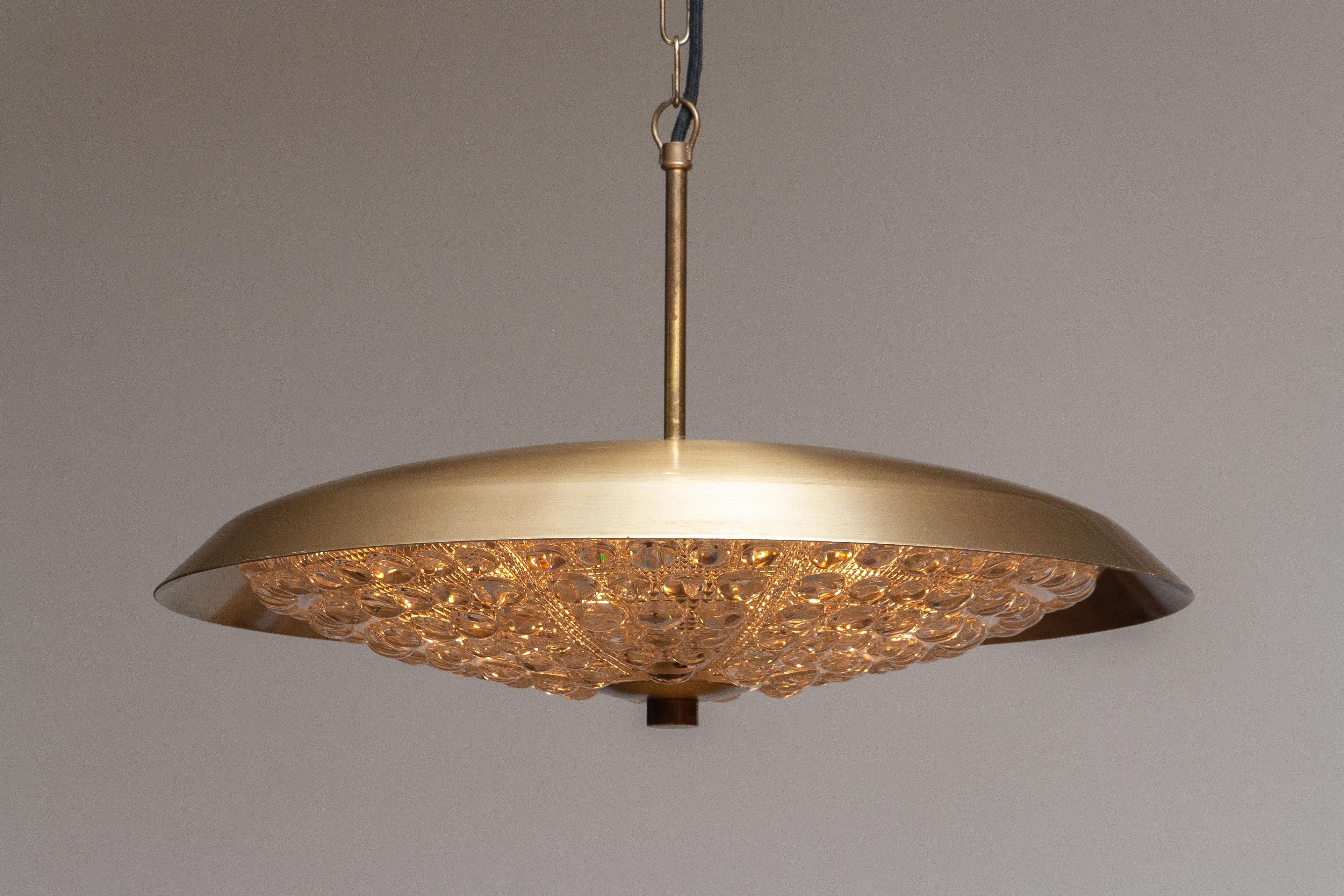 Mid-Century Modern 1950s, Brass and Glass Pendant Lamp Designed by Carl Fagerlund for Orrefors