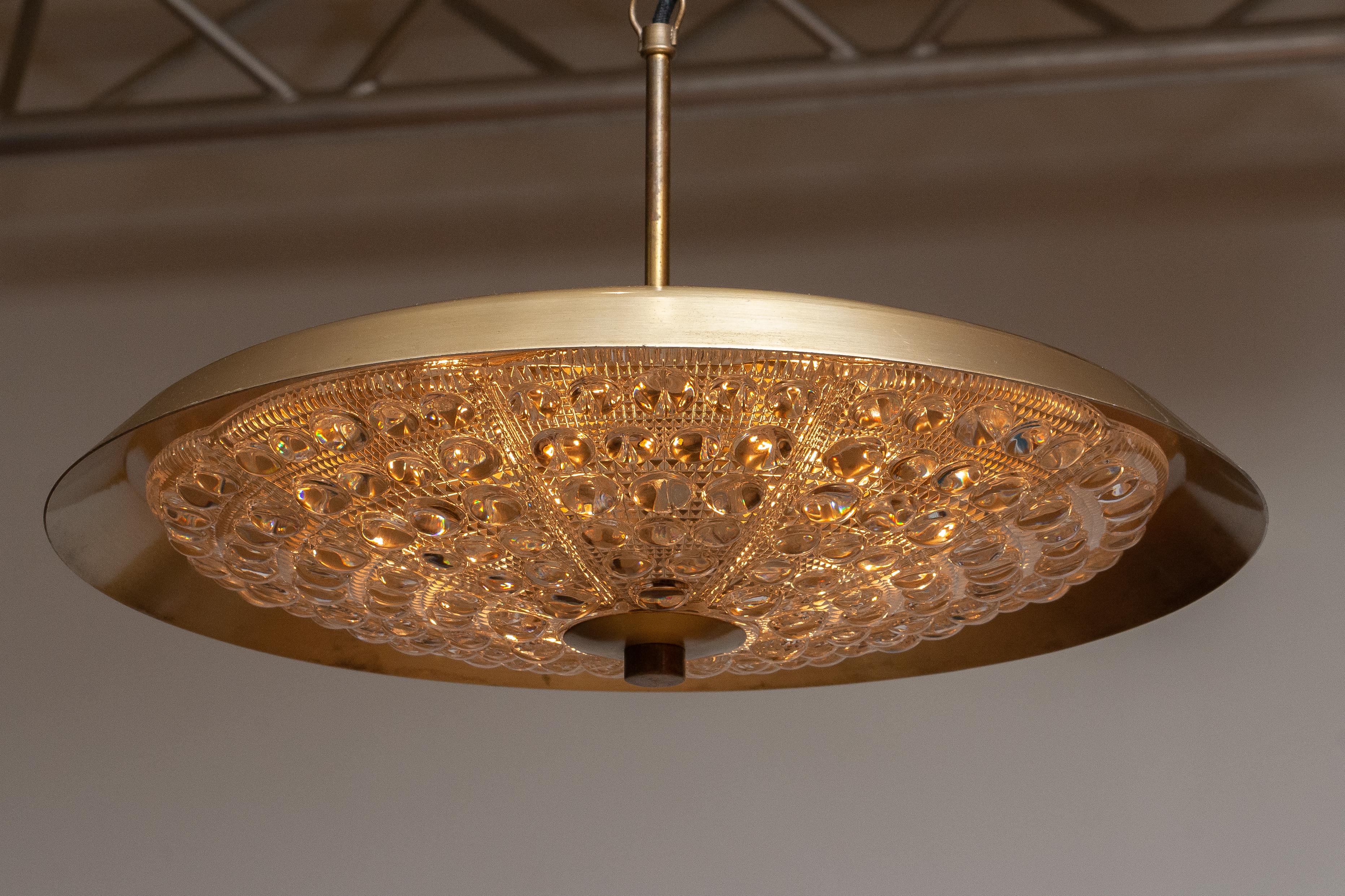 Mid-Century Modern 1950s, Brass and Glass Pendant Lamp Designed by Carl Fagerlund for Orrefors