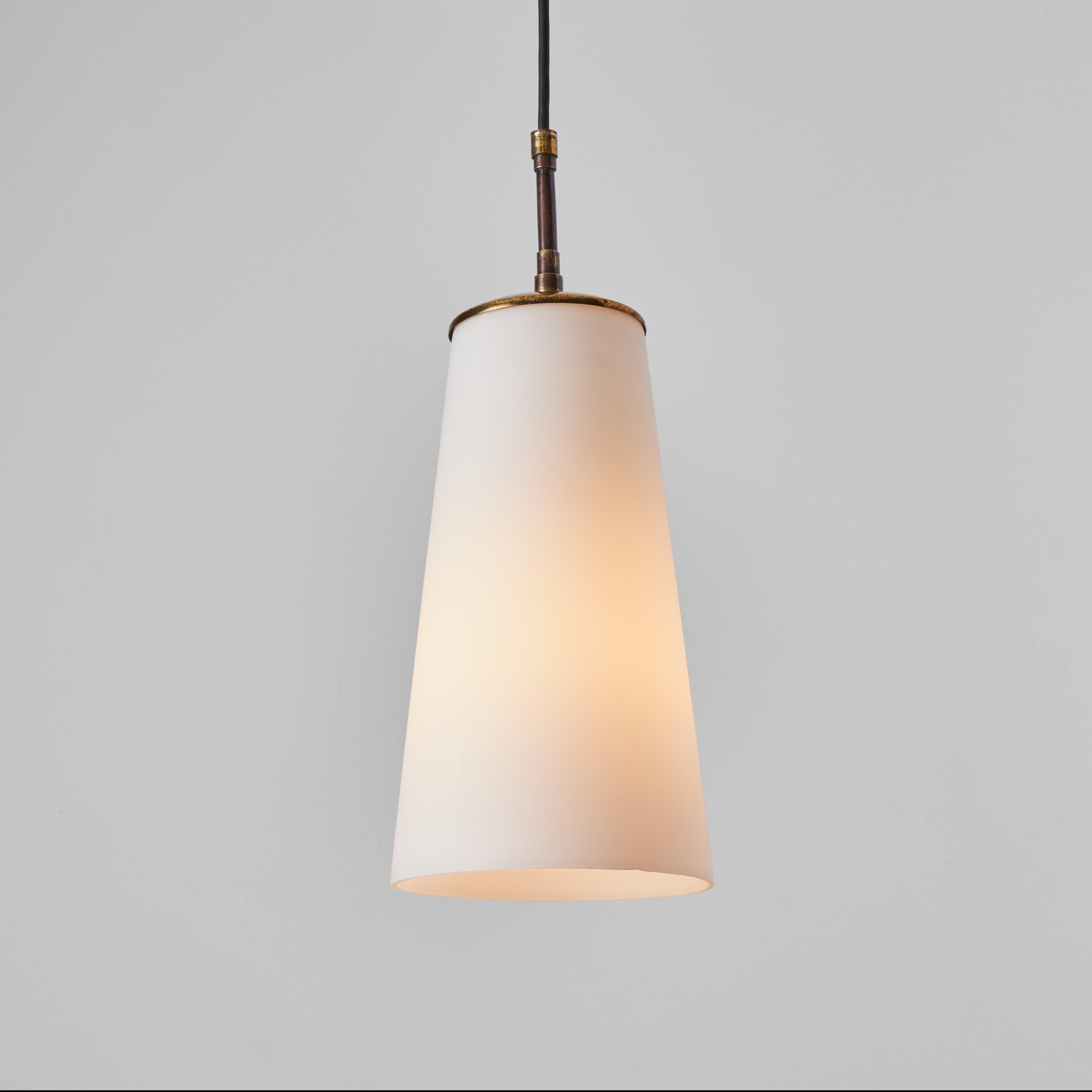 1950s brass and Opaline glass pendant lamp attributed to Stilnovo. Executed in geometric opaline glass with brass hardware and canopy. An incomparably clean and refined design characteristic of midcentury Italian lighting at its highest level.