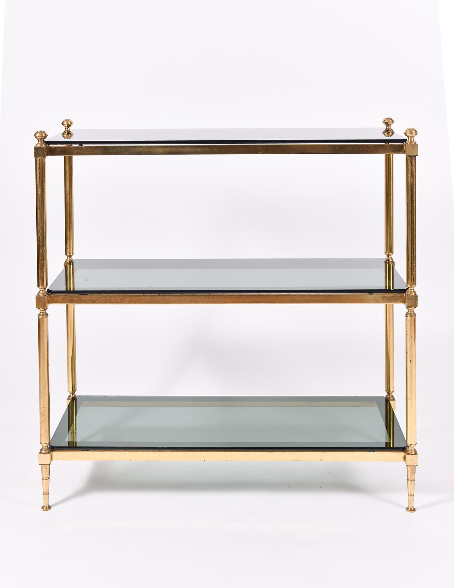 A brass and smoked glass top three-tiered console table
Sweden, circa 1950.