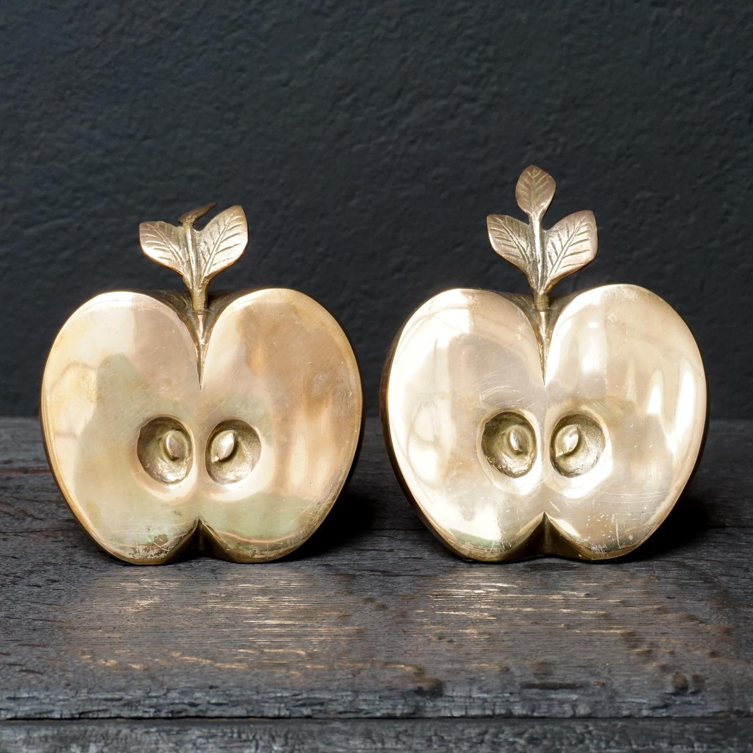 Beautiful set of two half shiny brass apple parts.

Nice and heavy because of the brass and because they are filled with sand.
I love an apple a day, or half an apple for that matter, don't you?.