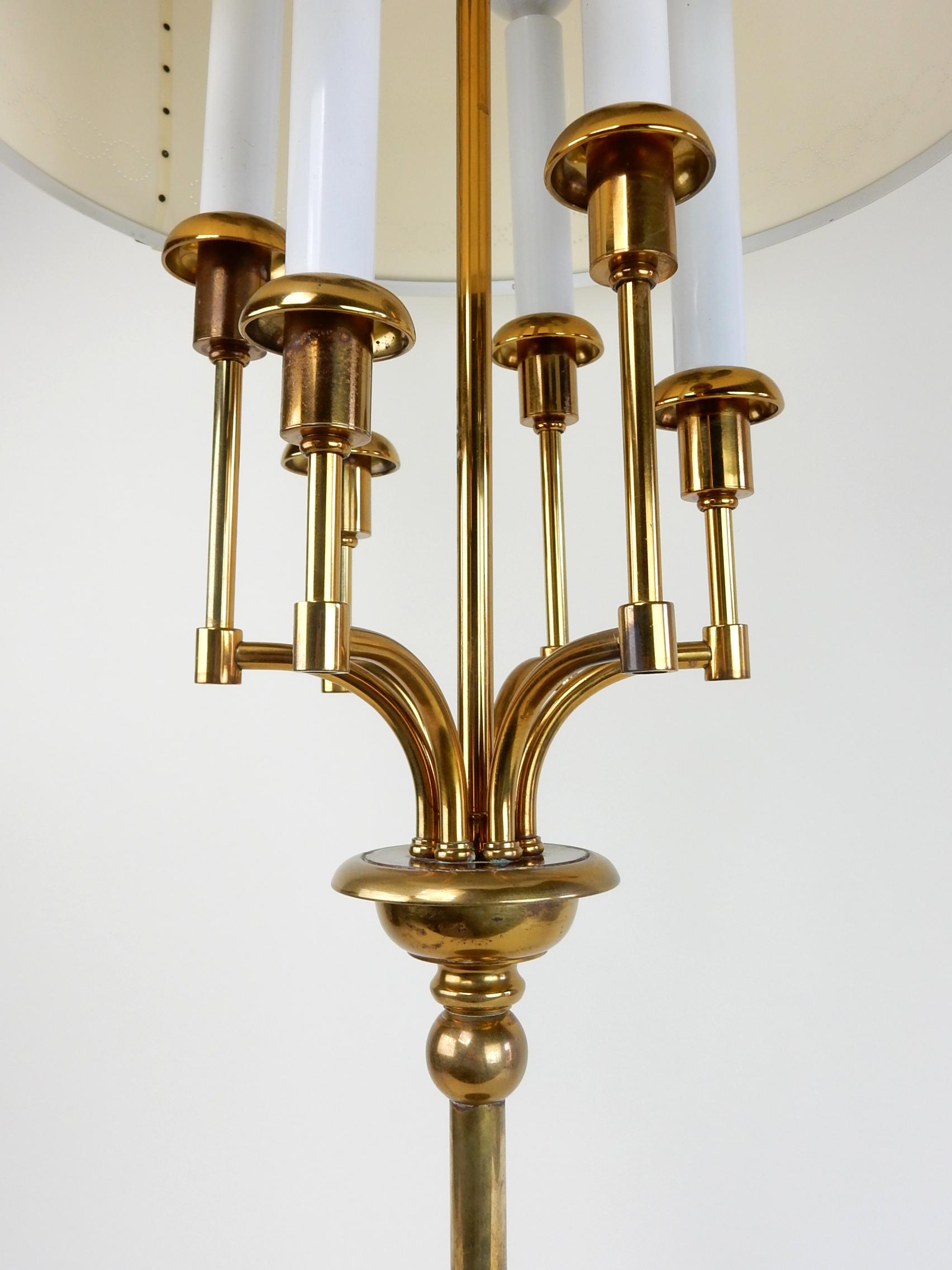 A truly unique 1950s candelabra table lamp with it's original shade.
It's design and high quality assures it to be a designer piece but we were not able
to find another example.
3 way switch control the candle size bulbs.
 