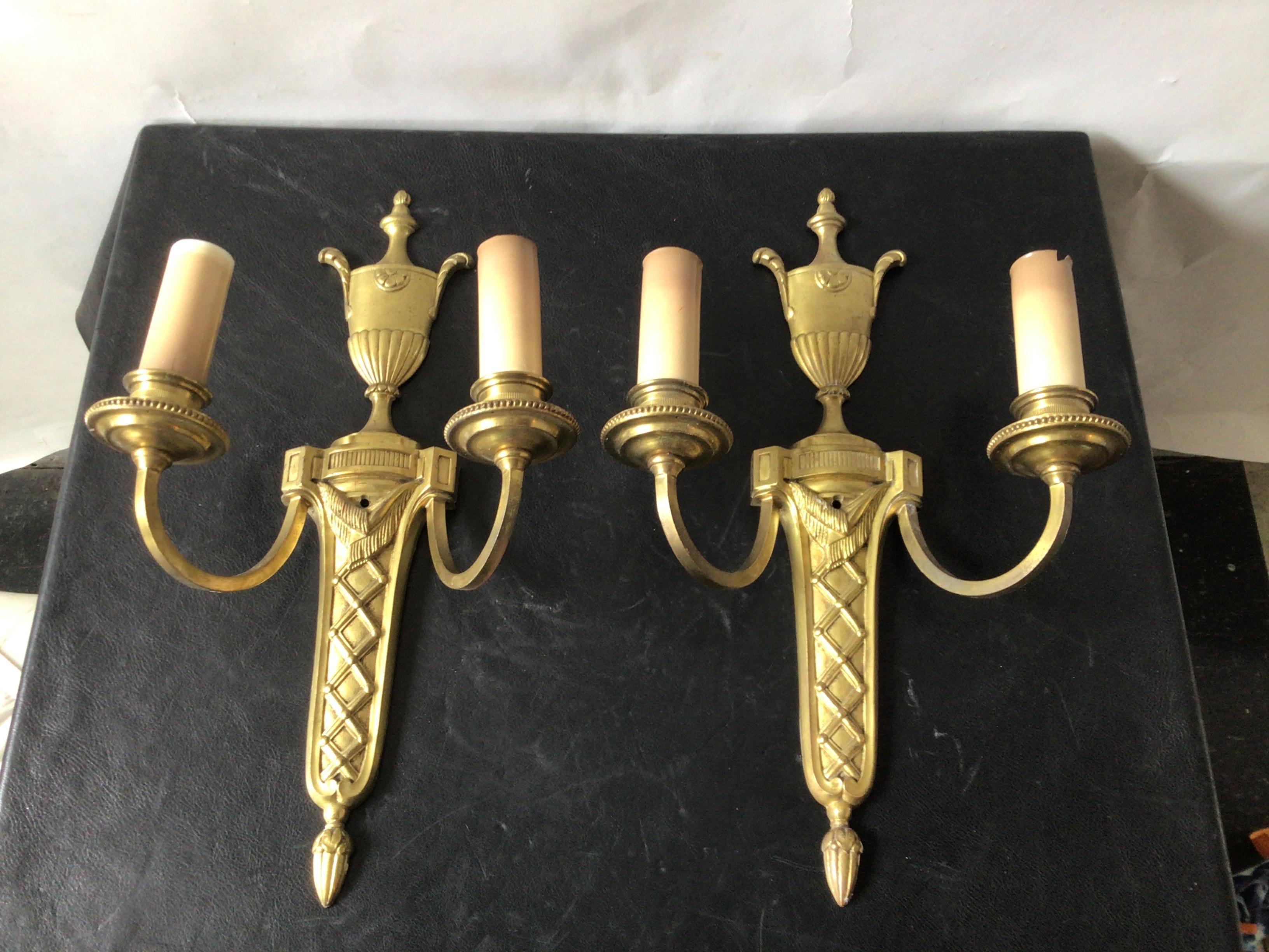 1950s Brass classical urn sconces. Reproduction of a Caldwell design.