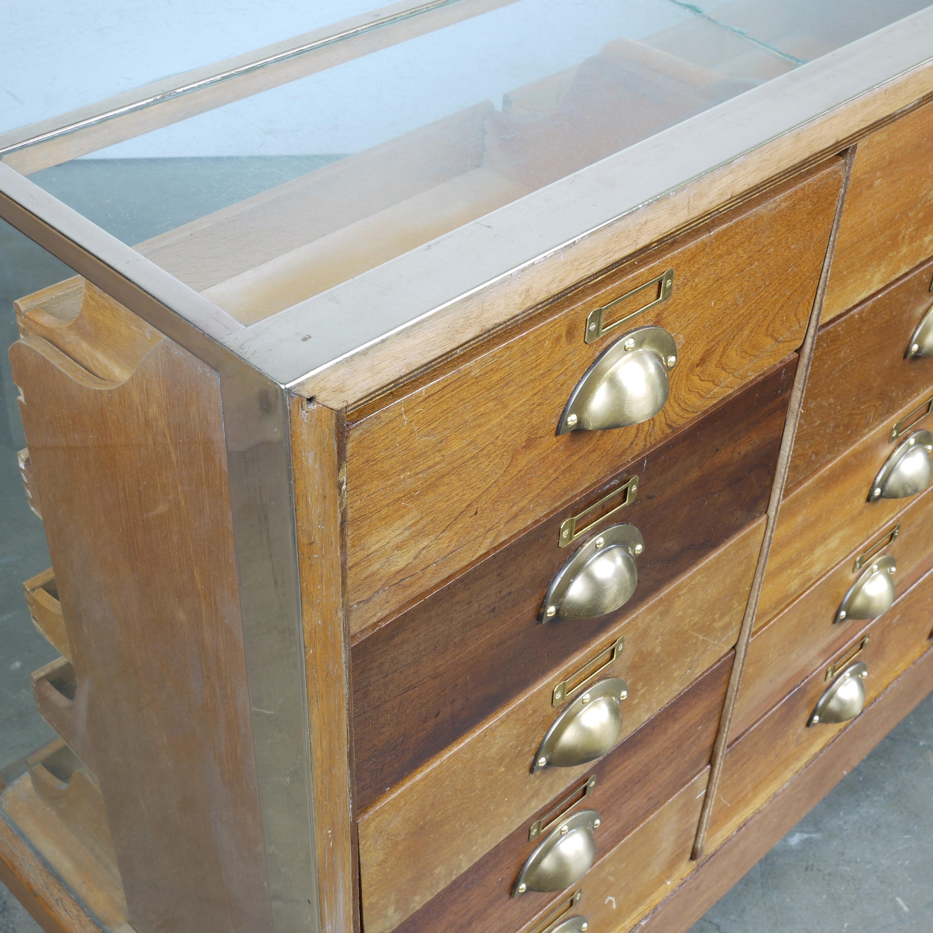 1950s vintage brass frame haberdashery cabinet, chest of drawers, storage cabinet. Sourced from a shop in North Yorkshire this is a very special original haberdashery cabinet with the double brass banding on the glass top and a complete brass frame.