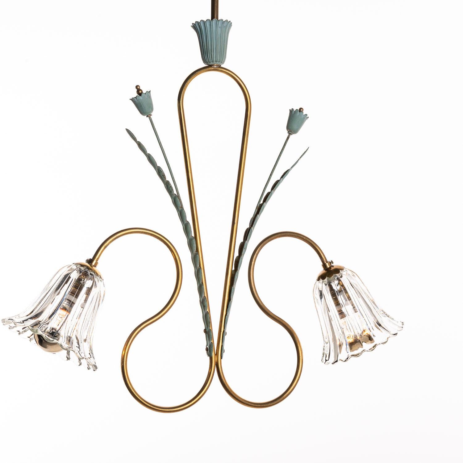This is a beautiful brass, polychromed metal and glass piece in the style of Pietro Chiesa. It embraces elegant curvature to give a feeling of harmony and flow throughout the design. Two bulbs hidden in flower shaped glass diffuser on beautifully