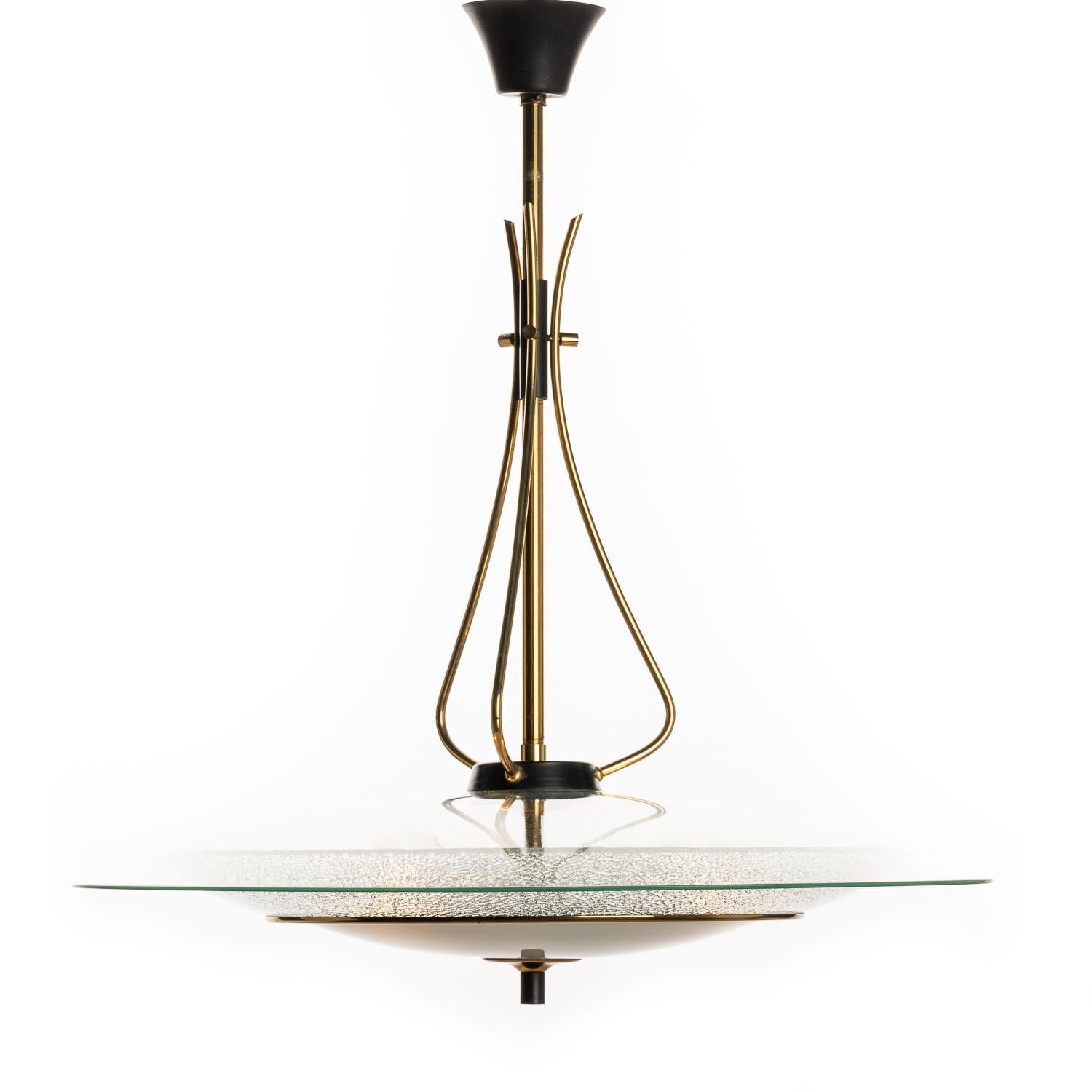 This Fontana Arte-inspired hanging pendant lamp is the perfect piece for those looking to capture a slice of the mid-century design ethos. Understated at first glance, yet full of character and charm the more you learn. This lamp has a stunning