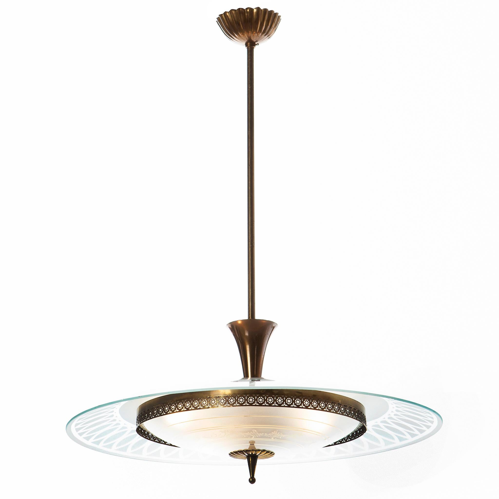 This stunning and super elegant light consisting of a brass frame and 2 unique glass reflector/saucers. 
The lower round curved glass reflector with gold patterns mounts below a larger round etched & clear glass reflector. A beautiful, decorated