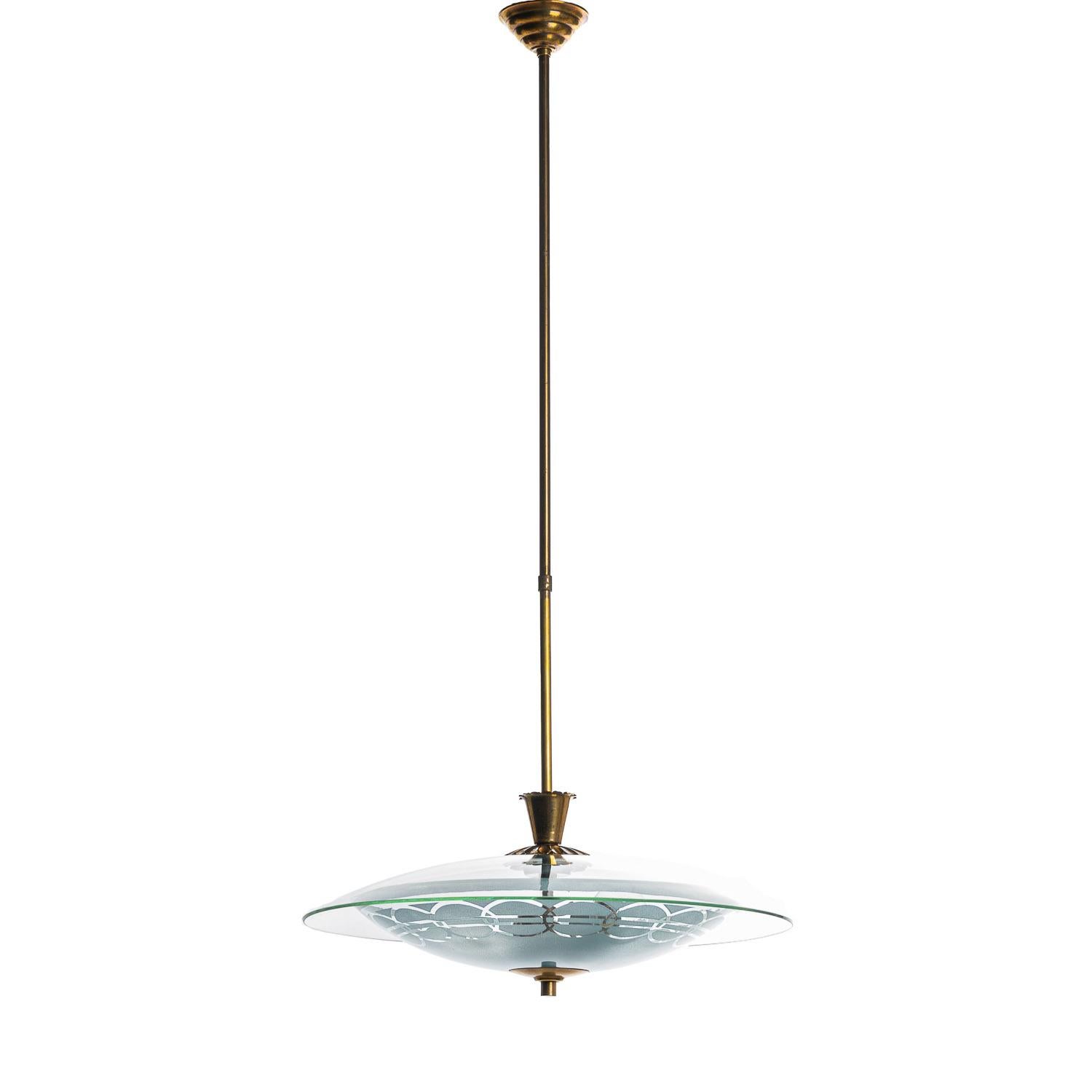 This elegant piece consisting of a brass frame and 2 unique satin glass reflectors. 
The lower round curved glass reflector with a blueish glow has etched motifs. The top round glass reflector is larger and crystal clear.
In the center 2