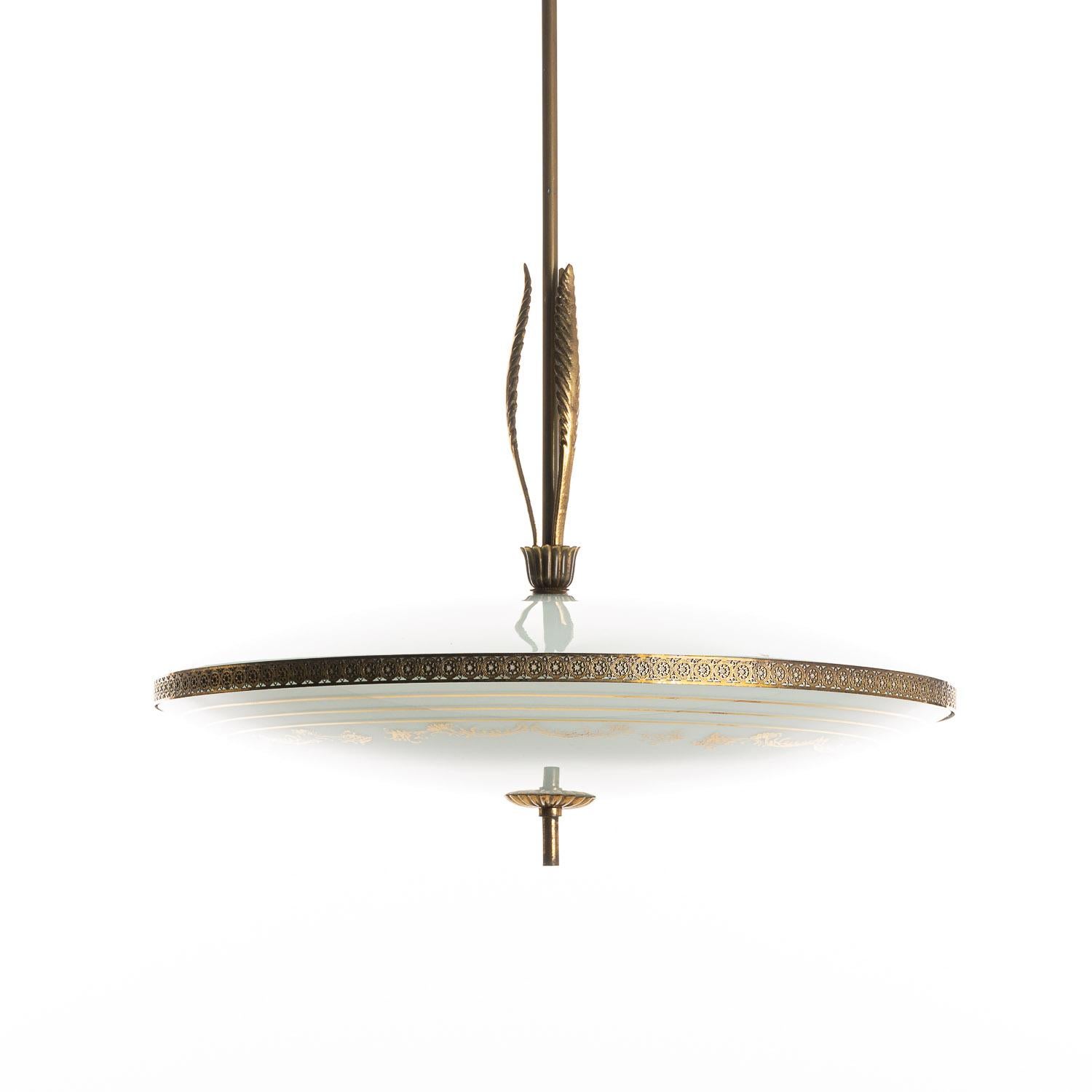 This is a beautiful 1940s pendant-style lamp in the style of Pietro Chiesa. The brass-feather ornamental pieces on the collar add a touch of character that complements the subtle decoration on the light-blue pendant glass. Please note there is some
