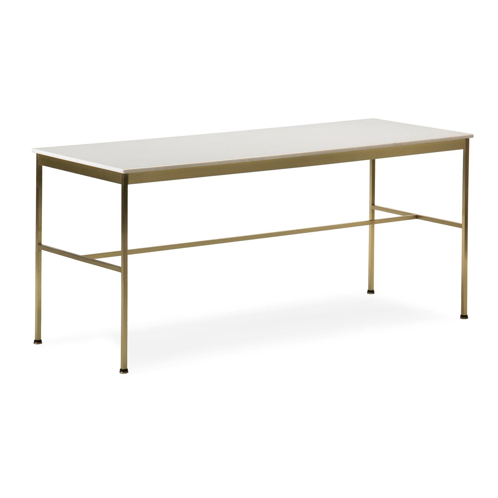 An elegant low coffee or cocktail table on a rectilinear brass base with a milk glass top.