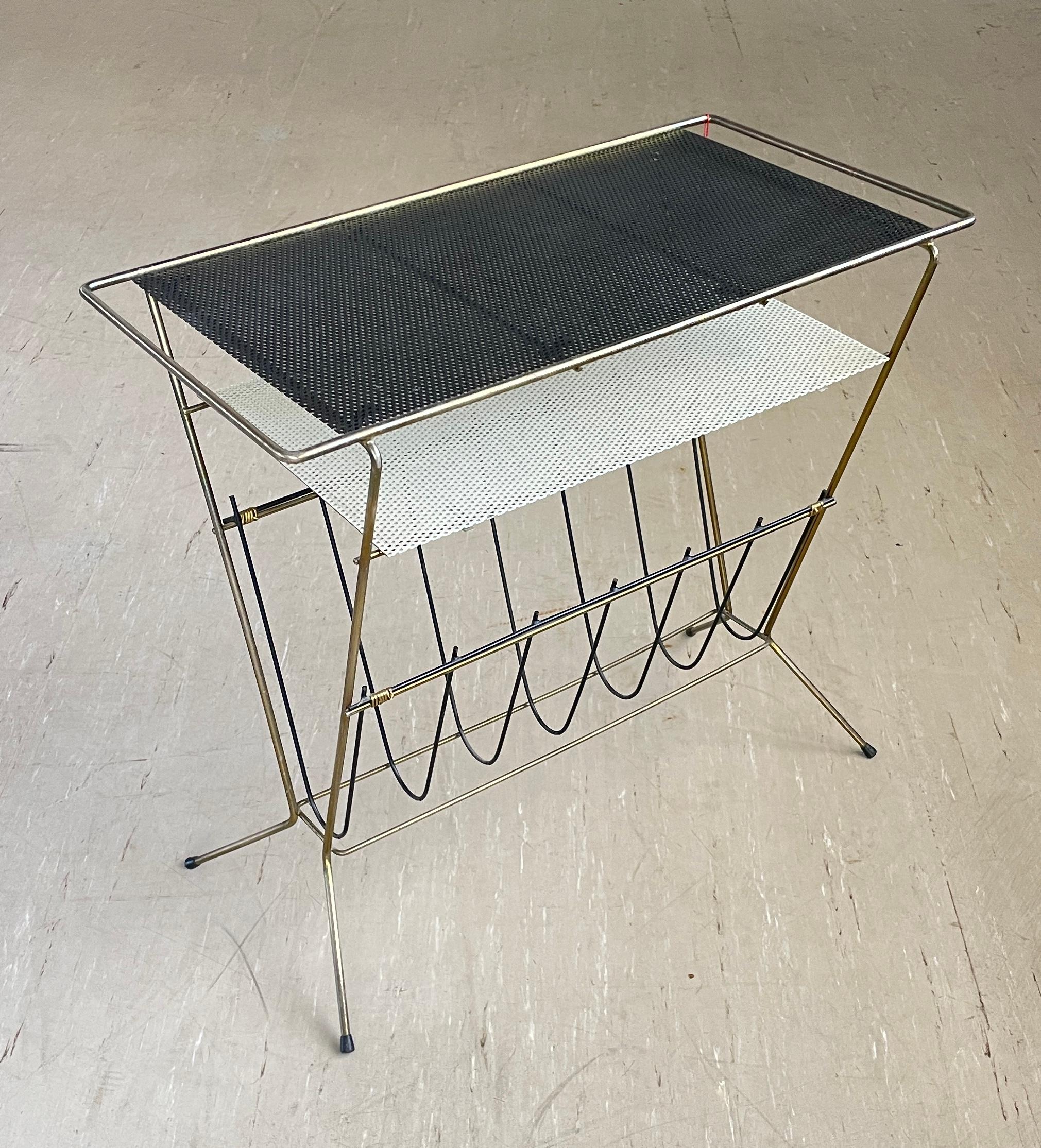 1950’s Brass Magazine / Newspaper Rack
Stylish Mid Century design with perforated sheet metal tabletop and tubular brass metal frame. Would compliment any contemporary interior space. For magazine / newspaper storage at home or a coffee shop,
