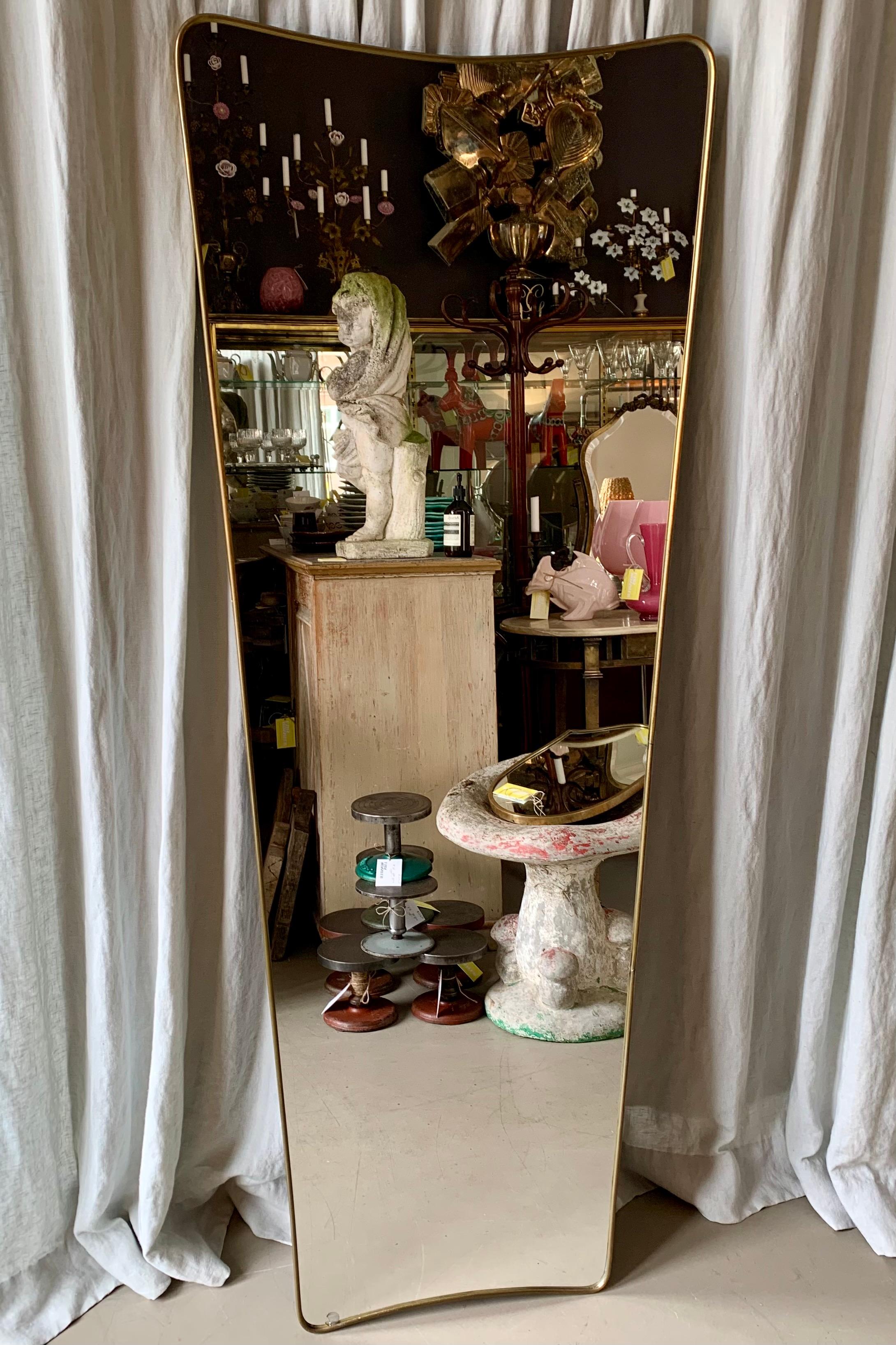 Large vintage Italian brass mirror with an elegant slender frame that holds the original mirror glass that has a small internal chip at the bottom - see photo. Perfect for the dressing- or bedroom, hanging or just casually leaning against the wall. 