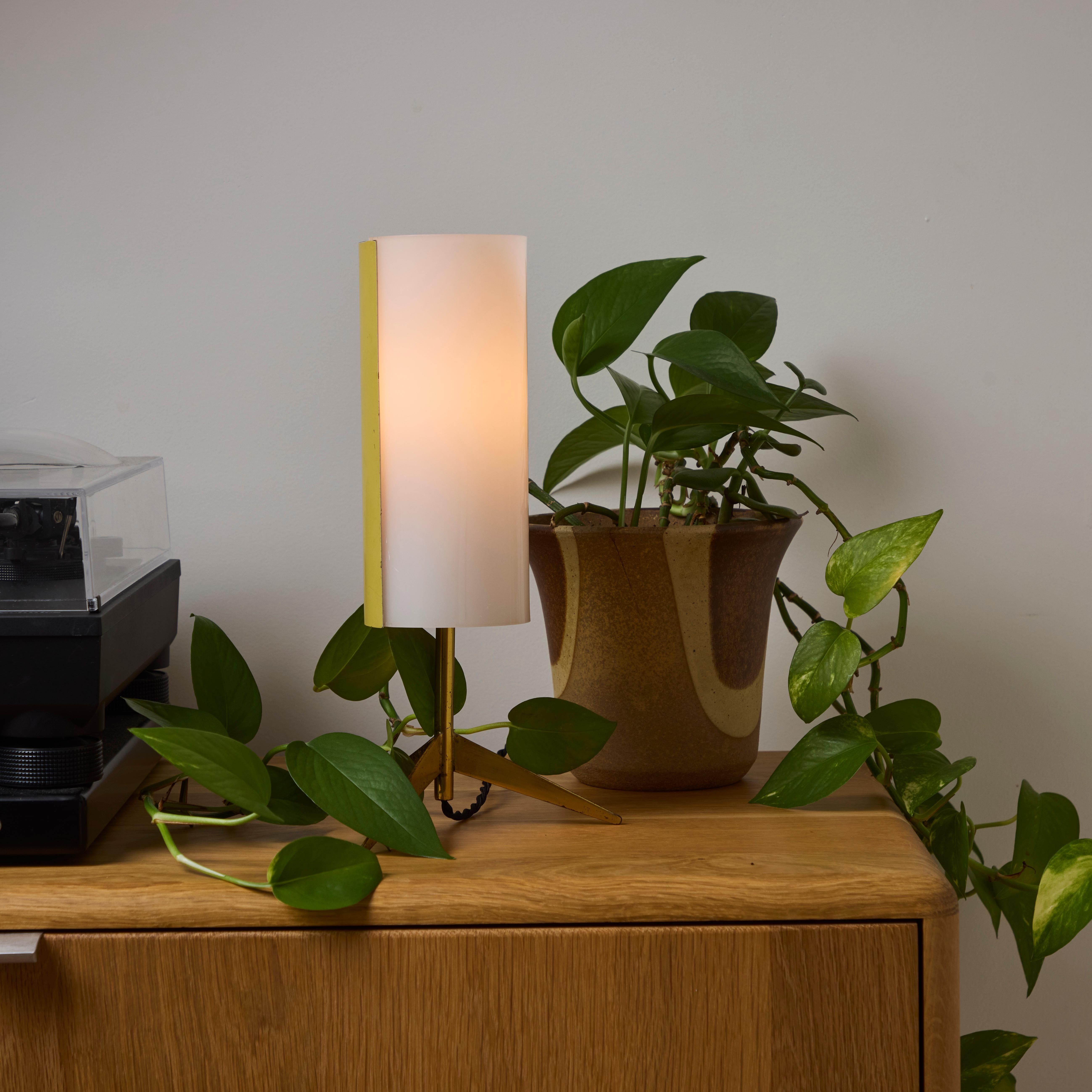 1950s Brass & Perspex Tripod Table Lamp by Stilux Milano.

This elegantly sculptural table lamp is characteristic of the highly refined Italian lighting design aesthetics of the midcentury era as embodied by the legendary firm of Stilnovo. Executed