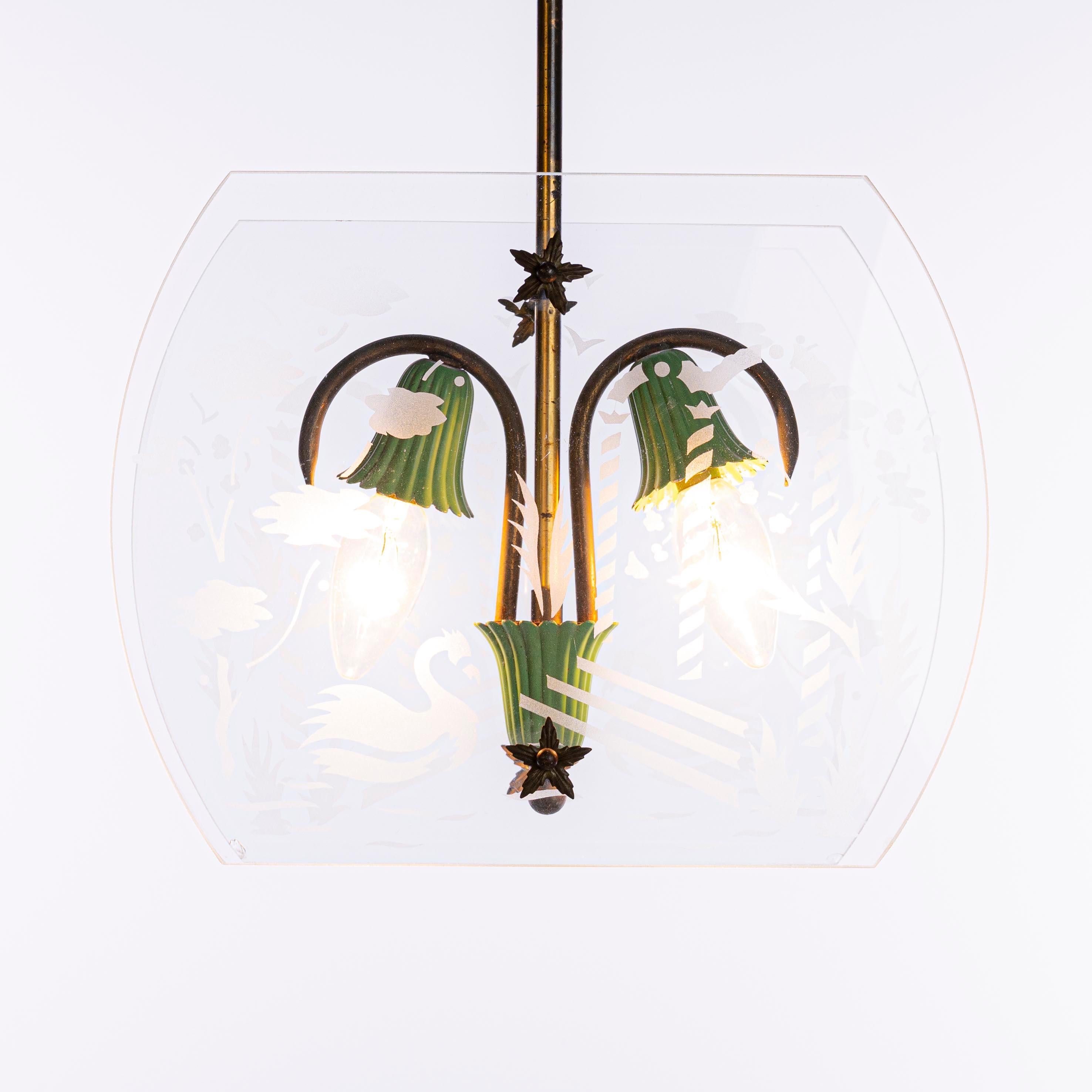 Cute two light lantern in style of Fontana Arte. Consists of two etched glass panels with etched Swans, a brass frame and green colored lamp E14 socket.
Glass panel 33cm width and 24 cm height. Two small chips in the corner of the panel.