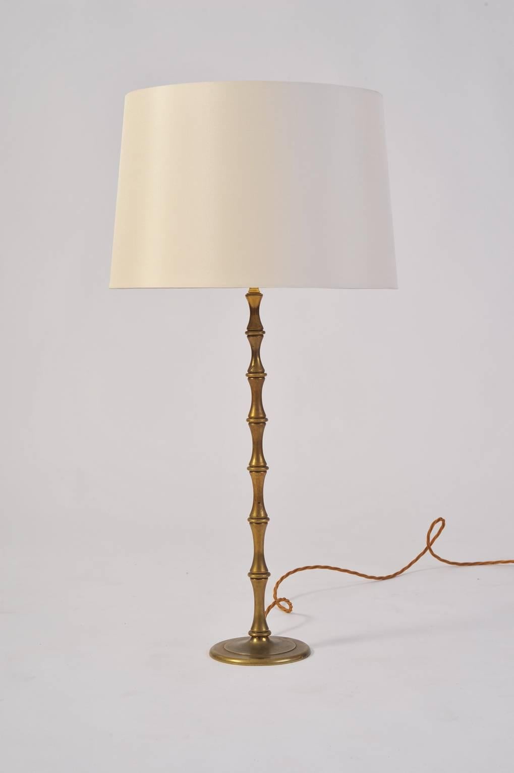 A brass stylized bamboo table lamp
France, circa 1950.