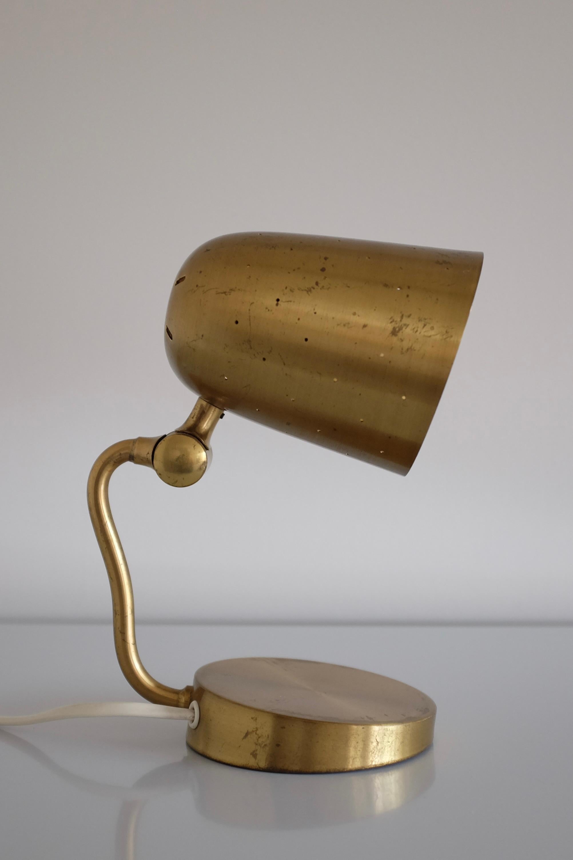Charming Brass Table Lamps from Boréns, Sweden. This modell is called 9303 and from the 1950s. Flexible arm that can open and close the perforated lamp shade. The small even located holes on the shade gives a glowing light when turned on. Patina to