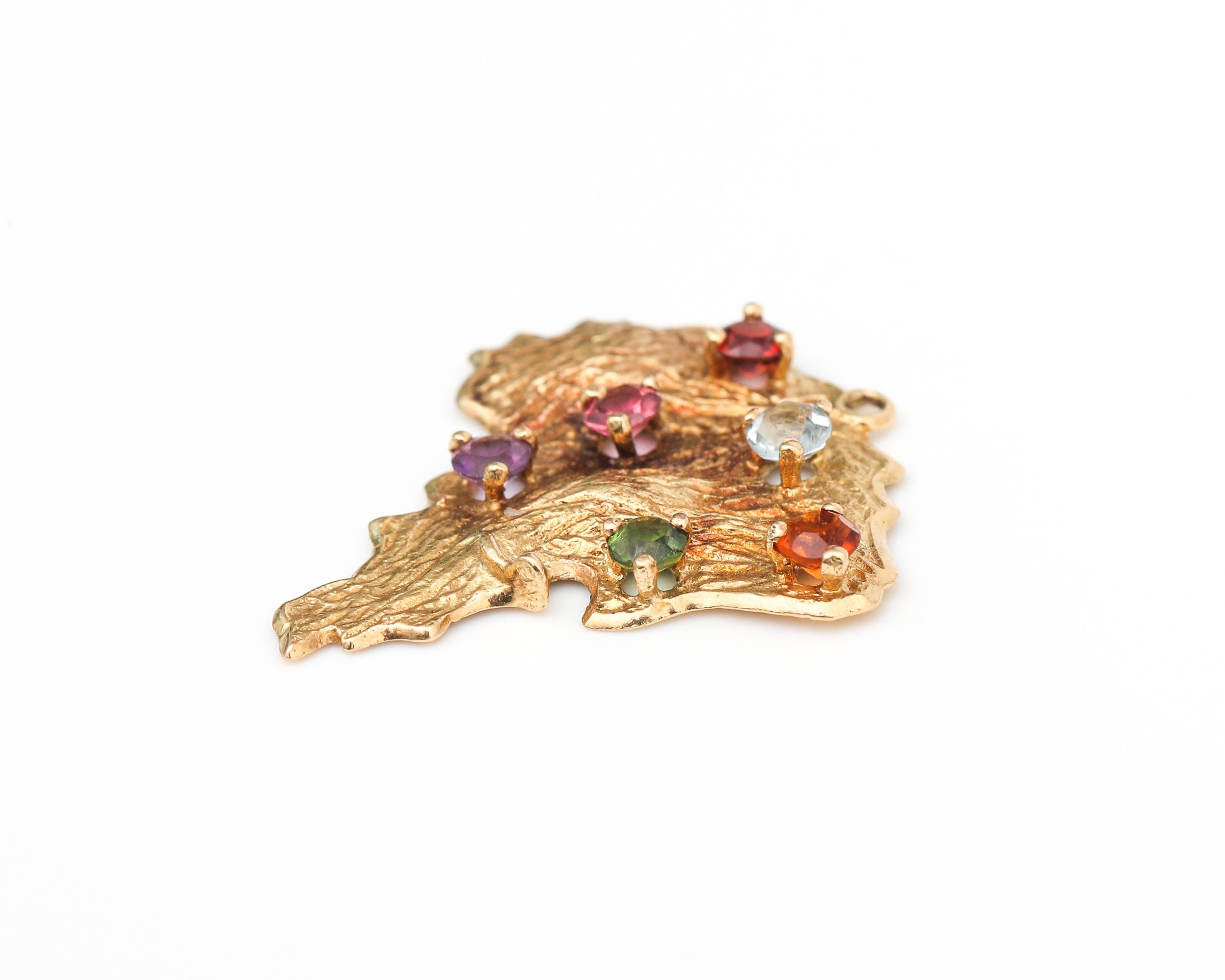 Adorable charm, made in Brazil, featuring multi gemstones and crafted in 18 karat yellow gold

Gemstones include:
1. Topaz
2. Aquamarine
3. Rubelite
4. Garnet
5. Tourmaline
6. Amethyst 
All gemstones are .10 carat each approximately and one count of
