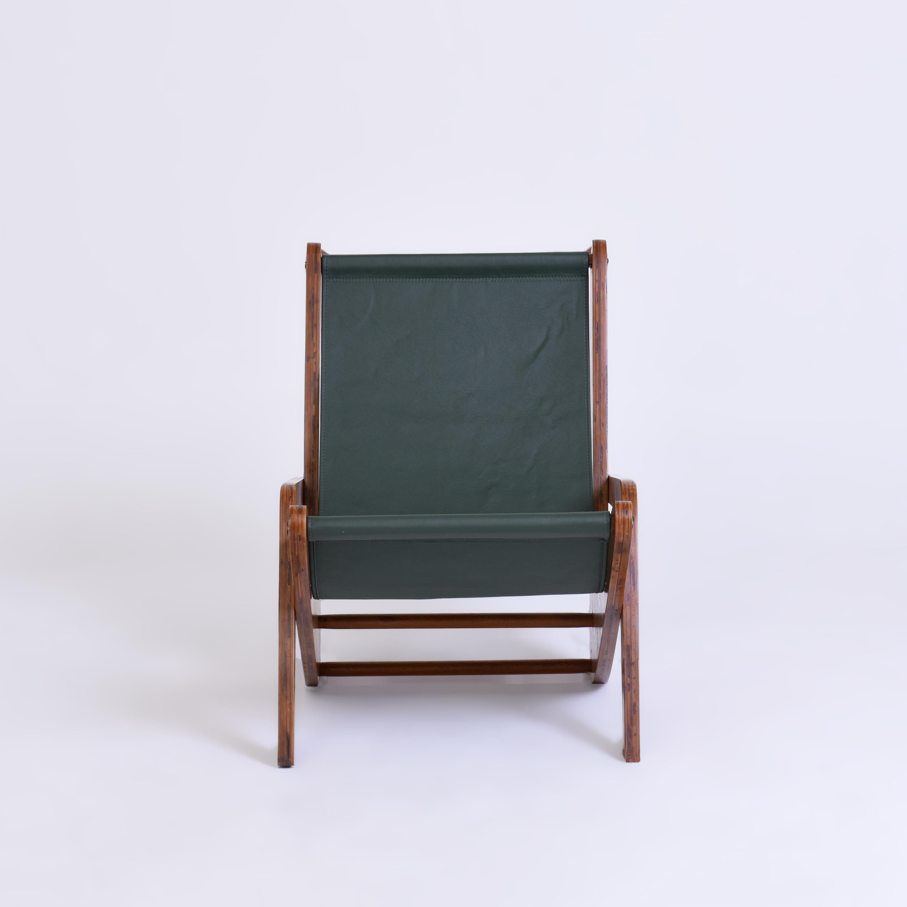 The Boomerang lounge chair by Jose Zanine Caldas is a special and unique piece of furniture, notable for its innovative use of materials, its elegant design, and the rich history of its creator. Made with a plywood structure and a green leather