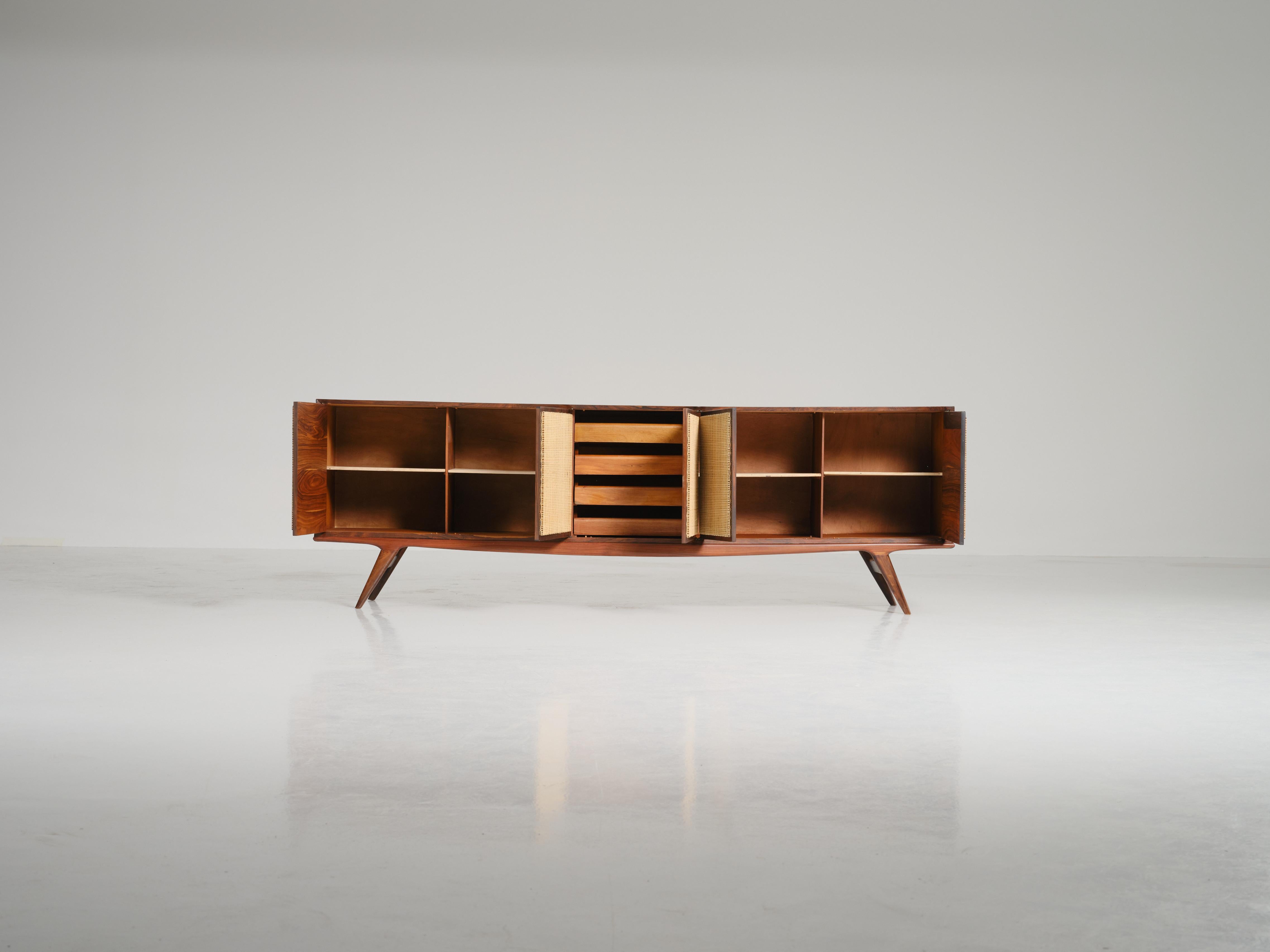 The 1950s sideboard, an attribution to Carlo Hauner stands as a testament to the visionary collaboration between Carlo Hauner (1927 — 1997) and Martin Eisler (1913 — 1977), primary designers for the iconic Brazilian furniture company Forma. Their