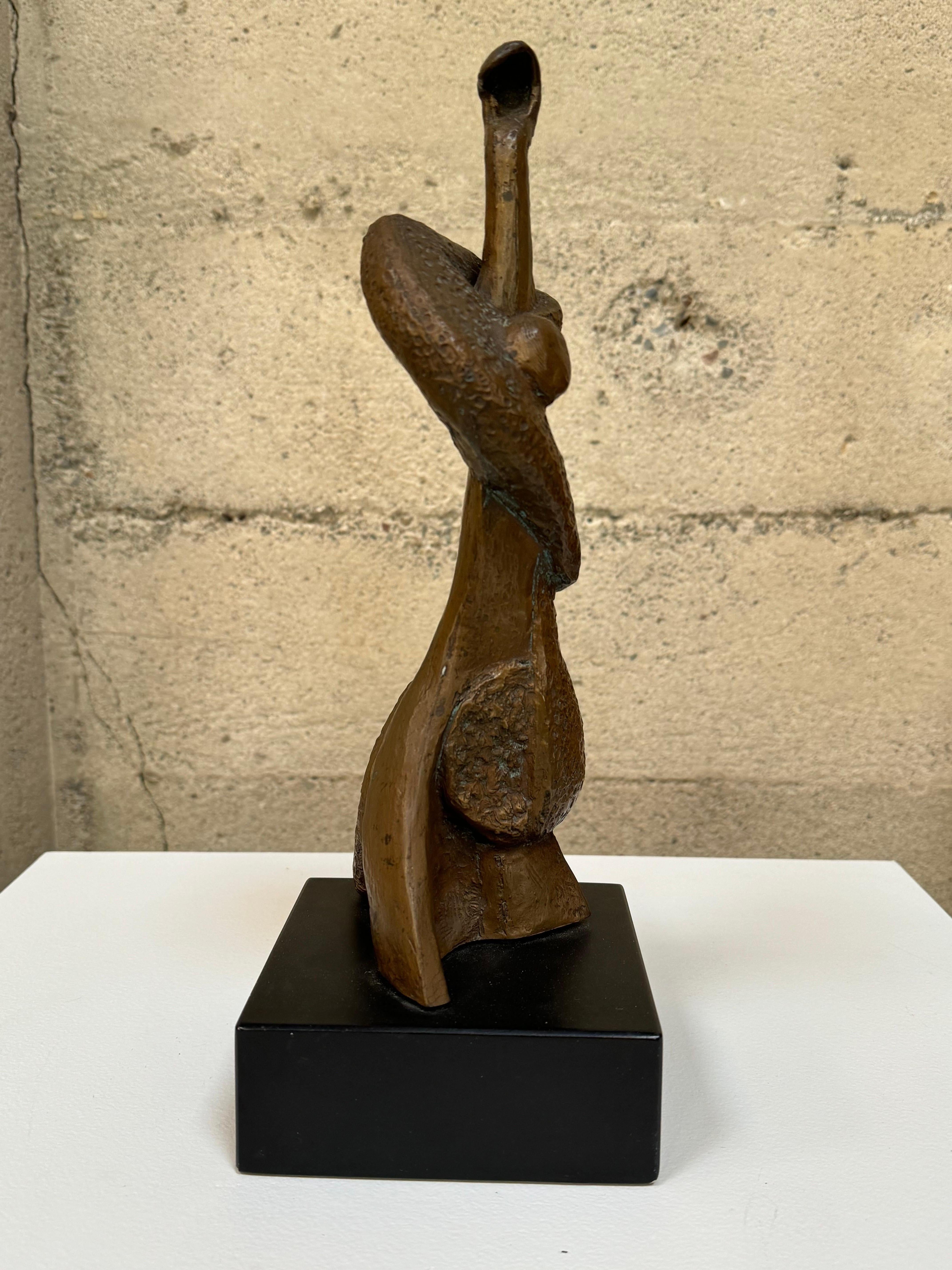 Signed cast bronze sculpture by Irma Stoloff and numbered 236/300. Having textured finish figurative abstract sculpture of a upright Jazz bass player resting on painted wood base.