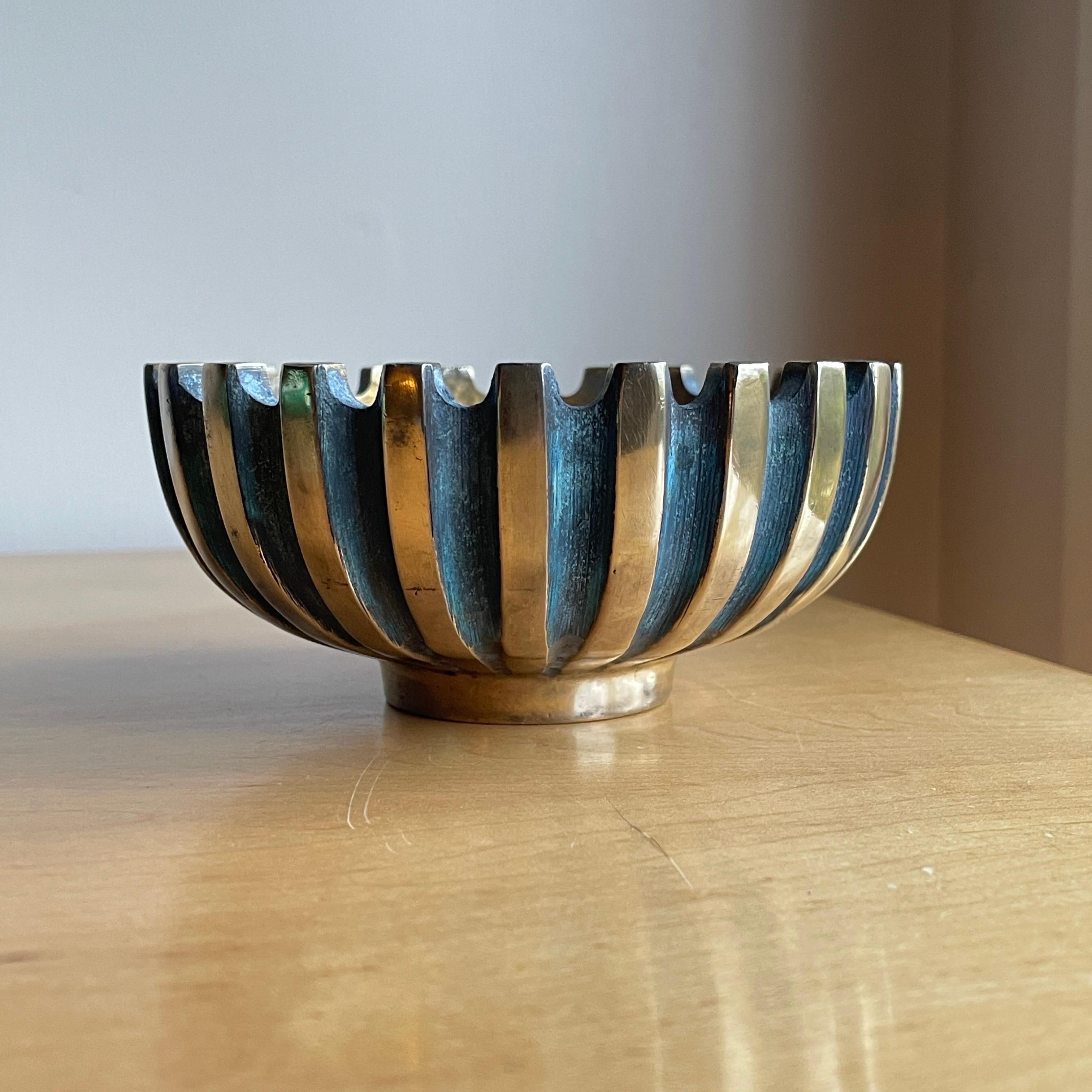 One of the real stand out pieces from the artist Maurice Ascalon from his company PAL-BELL, Israel. Great hand feel, with the divine heaviness Bronze possesses.  The contrast between the bluish/greenish matte surfaces and the polished surfaces are