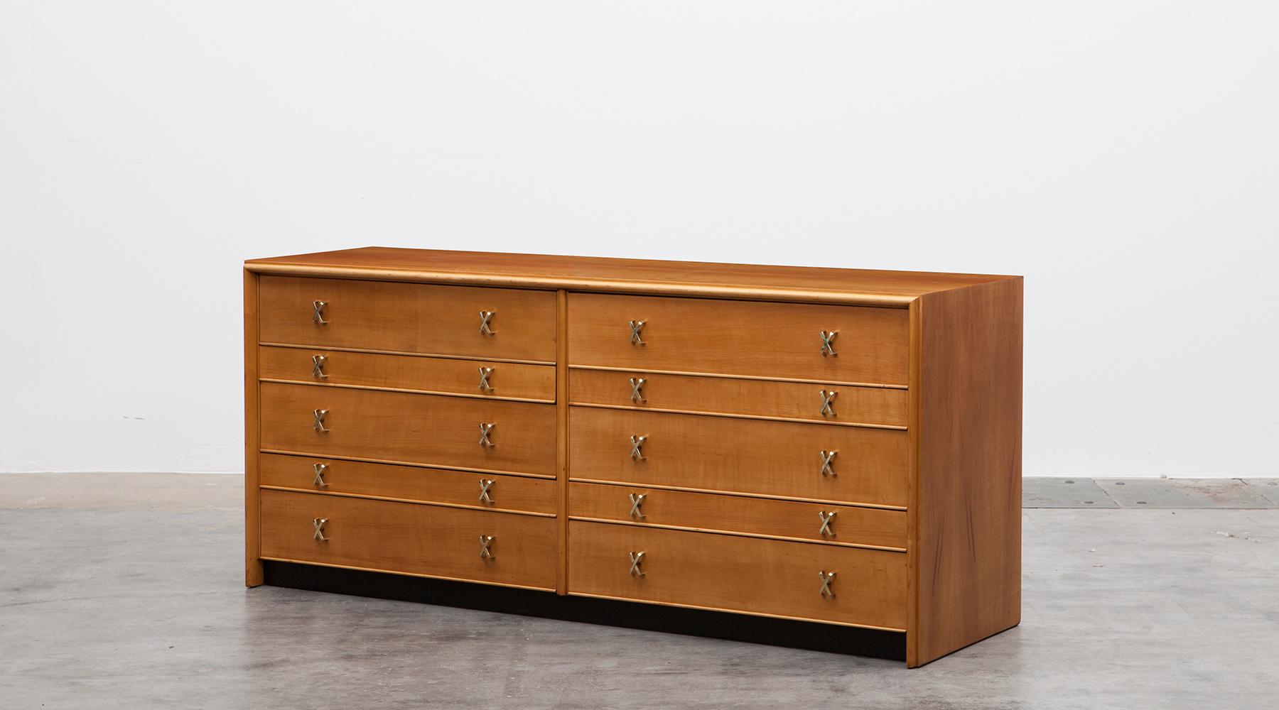 Sideboard in birch, brass details by Paul Frankl, USA, 1950.

The sideboard designed by Paul Frankl in birch has ten drawers in two different sizes. The small drawers are internally divided with small compartments. The famous Paul Frankl 