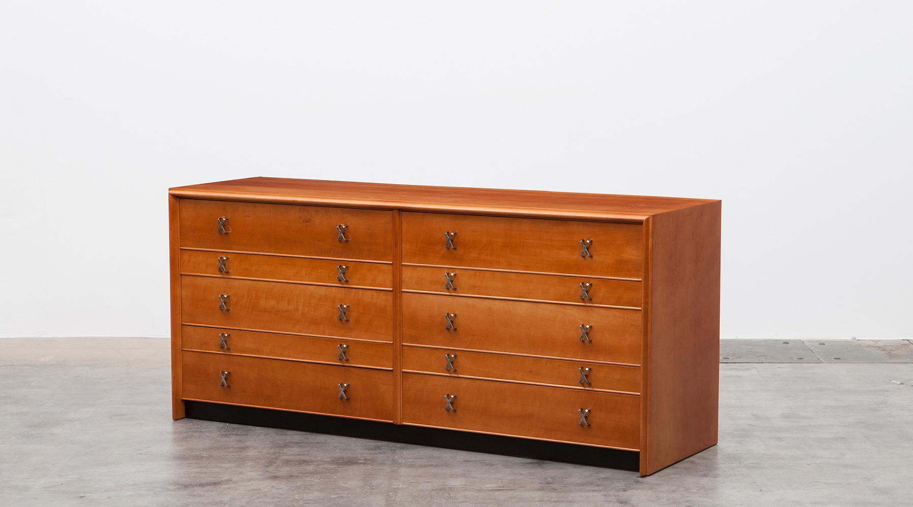 Sideboard in birch, brass details by Paul Frankl, USA, 1950.

The sideboard designed by Paul Frankl in maple has ten drawers in two different sizes. The small drawers are internally divided with small compartments. The famous Paul Frankl 