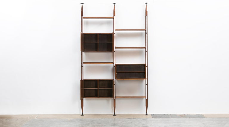 Teak and lacquered aluminum library, Franco Ablini for Poggi, Italy, 1950.

Stylish Franco Albini library or room divider comes in teak and this example with two rows. Shelves and units can be adjusted or moved to different positions. The legs are