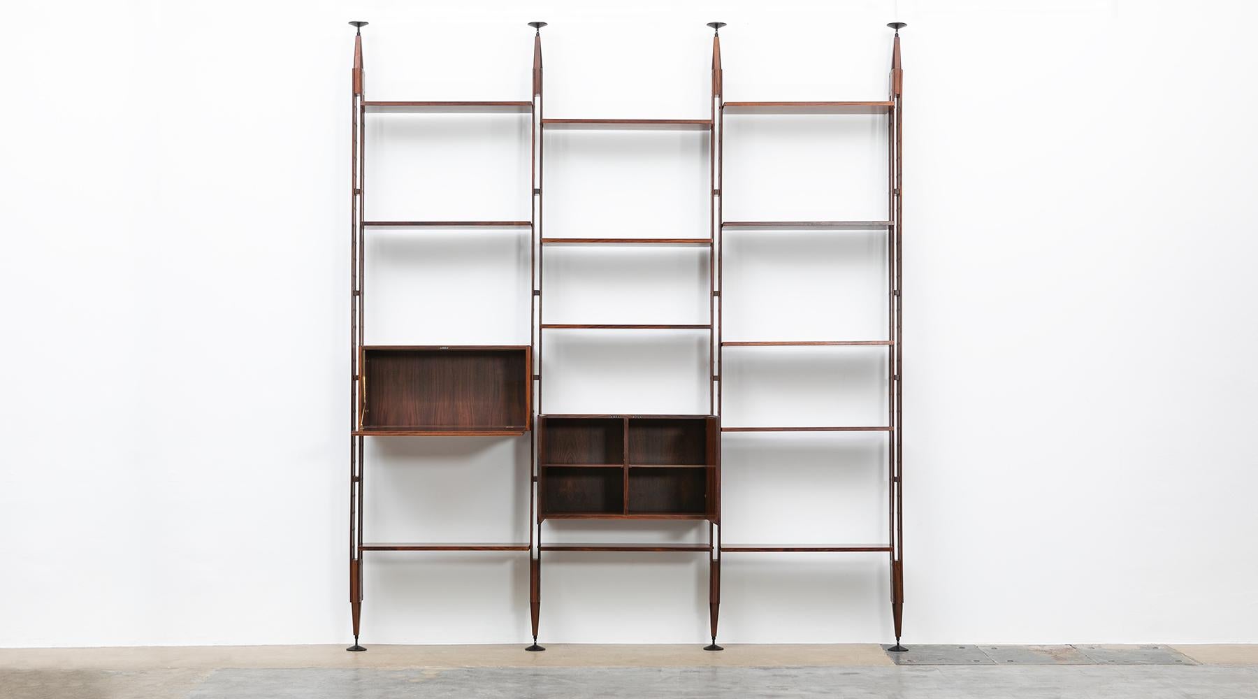 Teak and lacquered aluminum Library, Franco Ablini for Poggi, Italy, 1950.

Elegant Franco Albini library or room divider in teak comes in three rows. Shelves and the two units can be adjusted or put in different positions. The feet are in