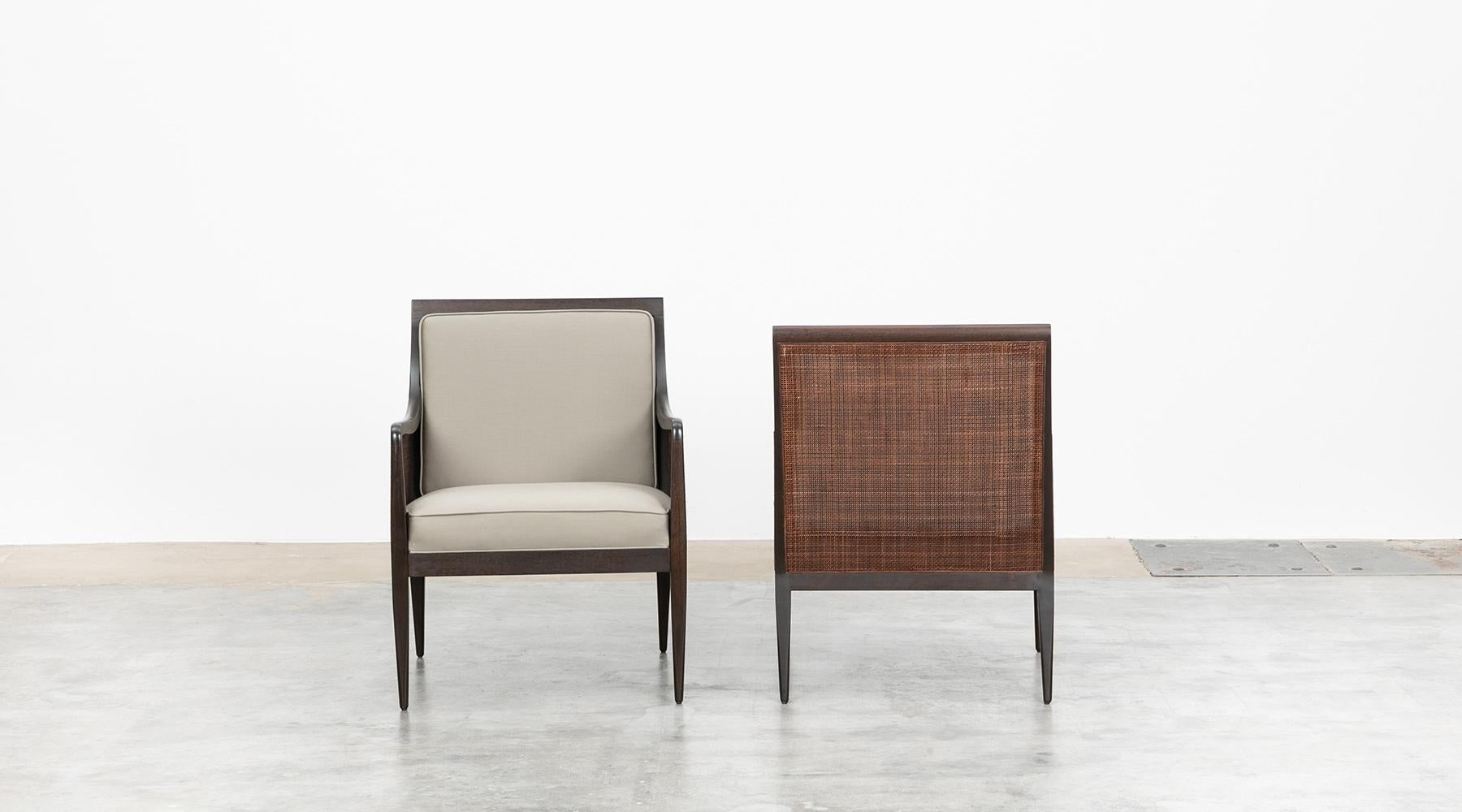 American 1950s Brown Walnut and Cane Lounge Chairs by Kipp Stewart, New Upholstery