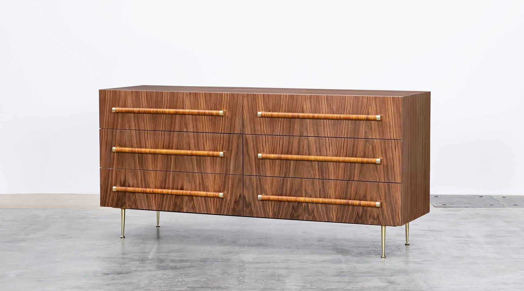Sideboard in walnut, rattan and brass details by T.H. Robsjohn-Gibbings, USA, 1954. Newly lacquered and all parts restored in our workshop. 

Fantastically simple and beautiful T.H. Robsjohn-Gibbings sideboard. The marvelous walnut wood is matched