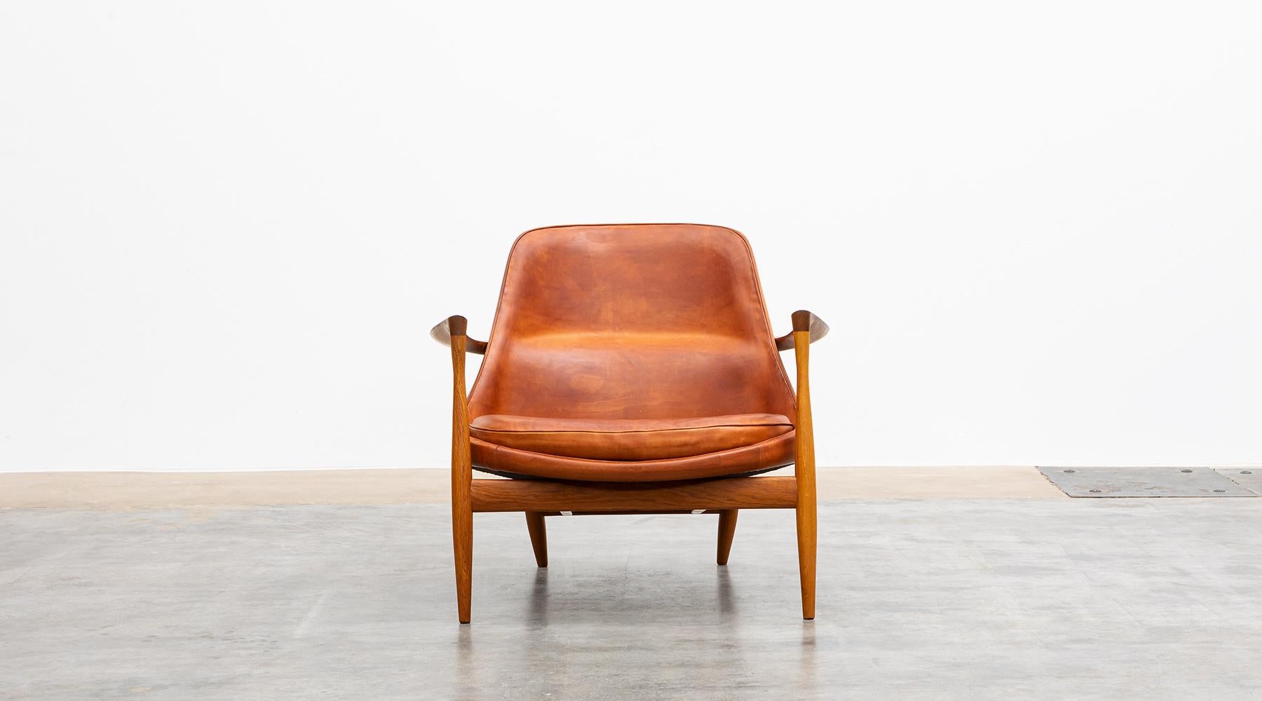 Matching lounge chair with ottoman, oak, leather, Denmark, 1956.

Wonderful example of Ib Kofod-Larsen lounge chair with ottoman in oak with amazing patinated cognac leather. The lounge chair and stool were created in 1956 and are in perfect