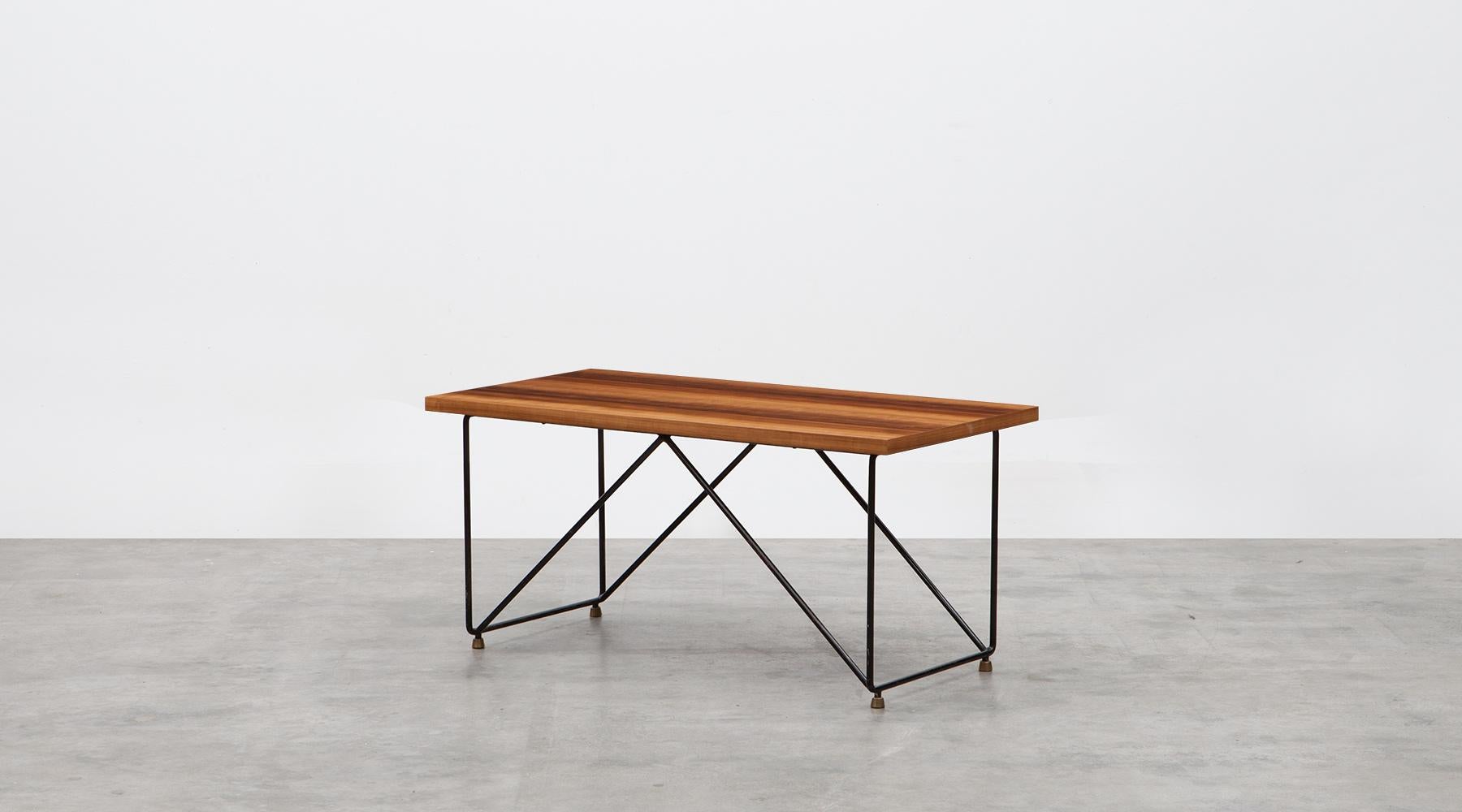 Veneer table top, metal frame, coffee table by Rinaldi Gastone, Italy, 1950.

Slim and delightful coffee table by Italian Gastone Rinaldi comes with a veneer table top, with a beautifully patterned structure, standing on four, geometrically
