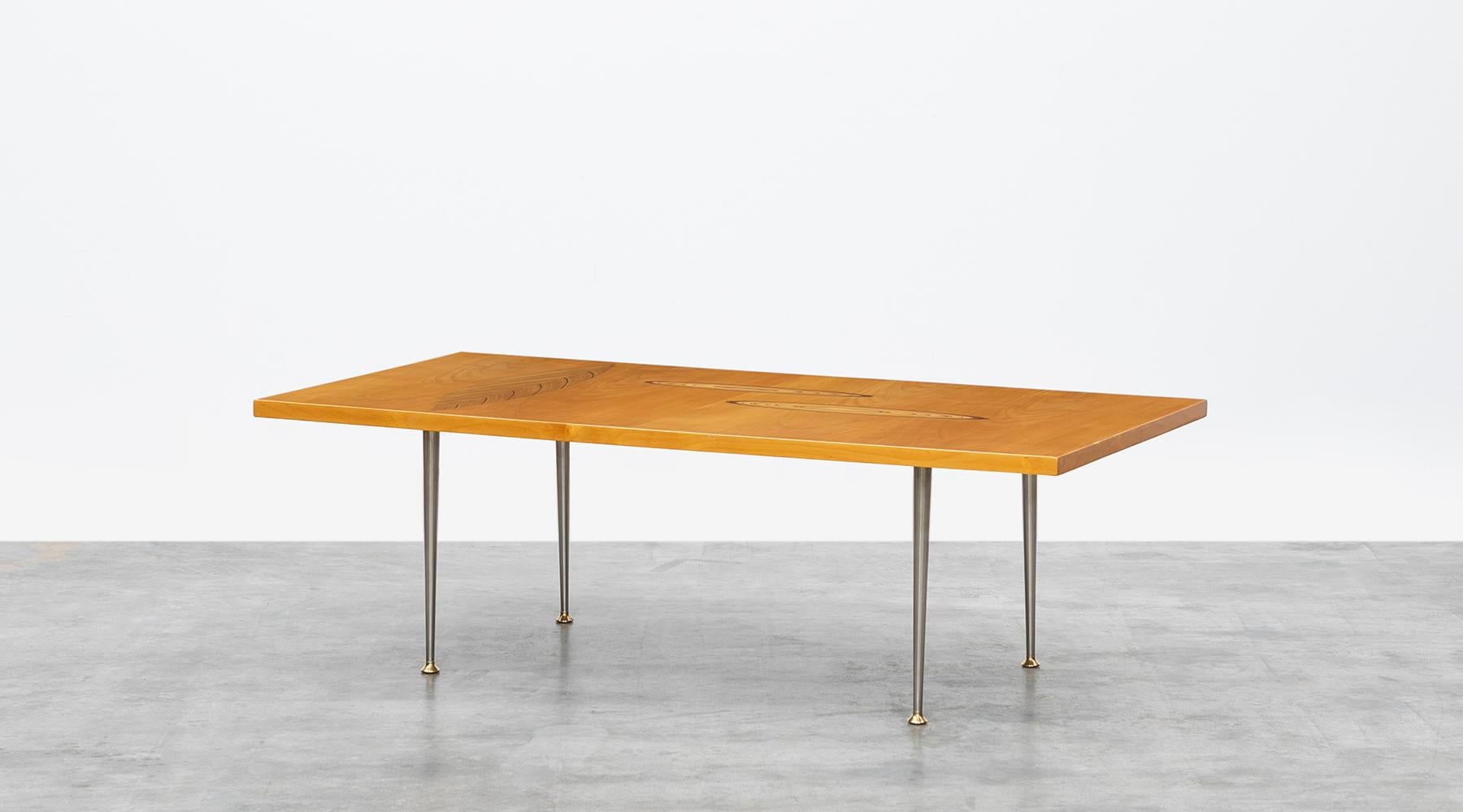 Veneered table top, metal base, Tapio Wirkkala for Asko, Finland, 1958.

Fantastic coffee table designed by Tapio Wirkkala in 1958. The veneered table top comes with a three wooden inlays in leaf ornament on a metal base. Manufactured by