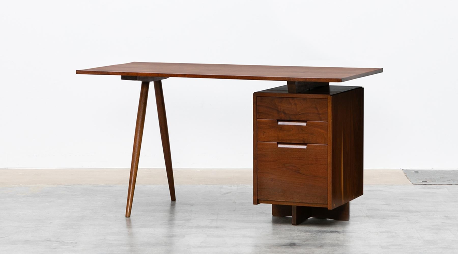 Desk by George Nakashima, American walnut, USA, 1959.

Handcrafted, stunning, marvellous desk. It is constructed with American walnut with handwork by George Nakashima himself. This handcrafted desk has a beautifully shaped American black walnut