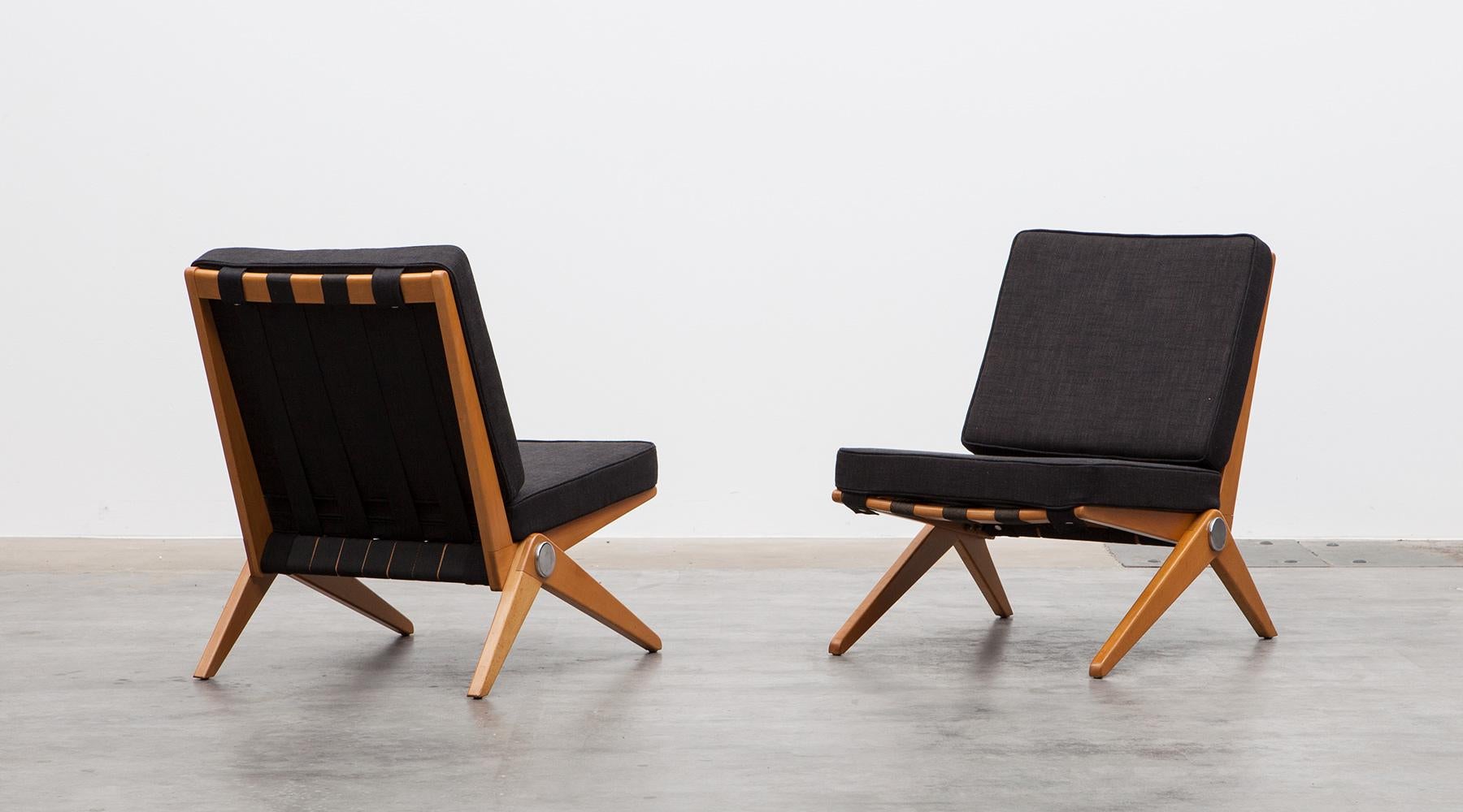 Pair of easy chairs designed by Pierre Jeanneret in teak, USA, 1952.

Set of subtle easy chairs with beautifully shaped wooden feet. The chairs are recently new upholstered in high-quality fabric and comes in perfect condition. Manufactured by