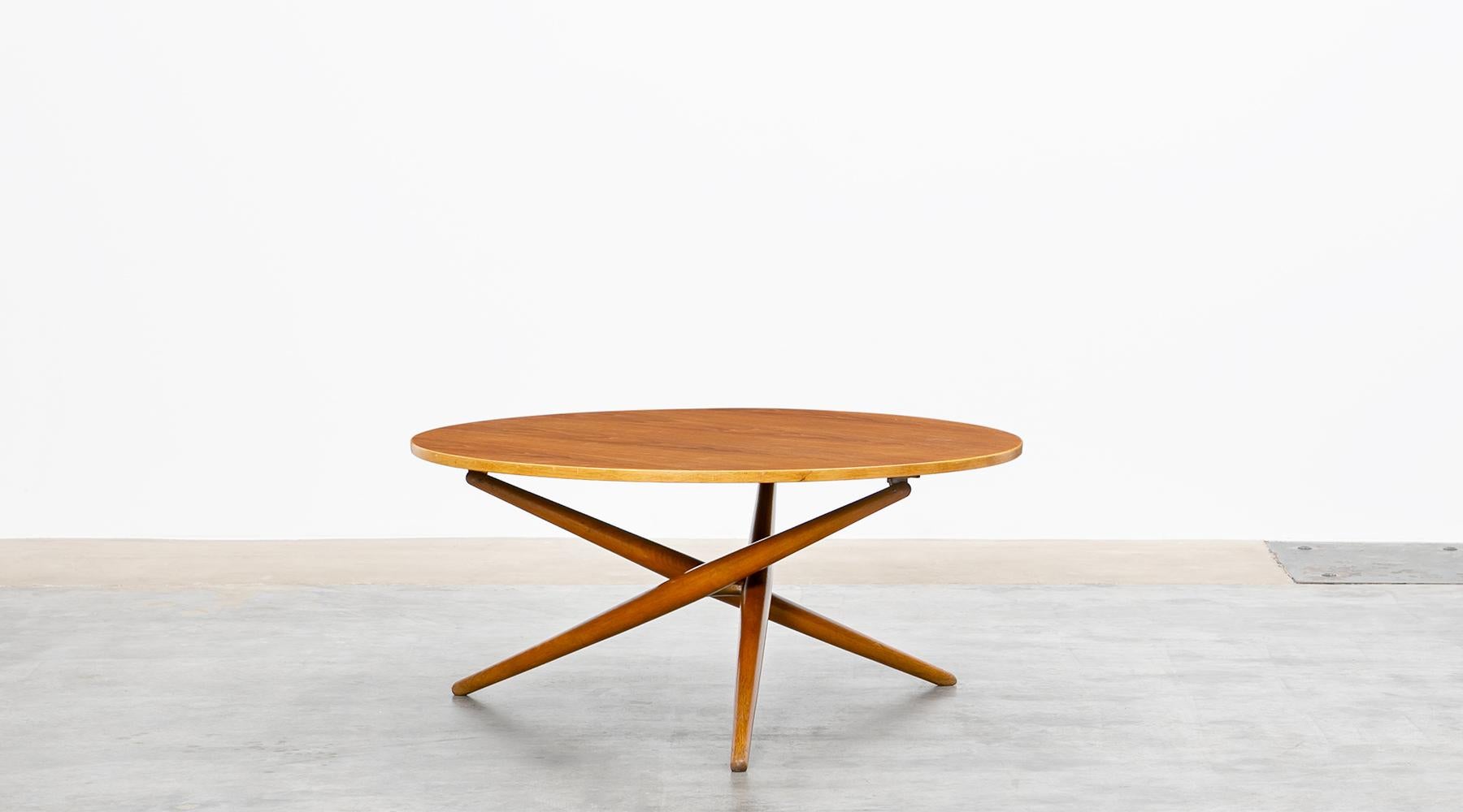 Adjustable side table in wood by Jürg Bally, Switzerland, 1951.

Iconic slim and graceful wooden eat and tea table by Swiss Jürg Bally from 1951. This model strongly reminds of a 1955 side table by US designer T.H. Robsjohn-Gibbings, differed only