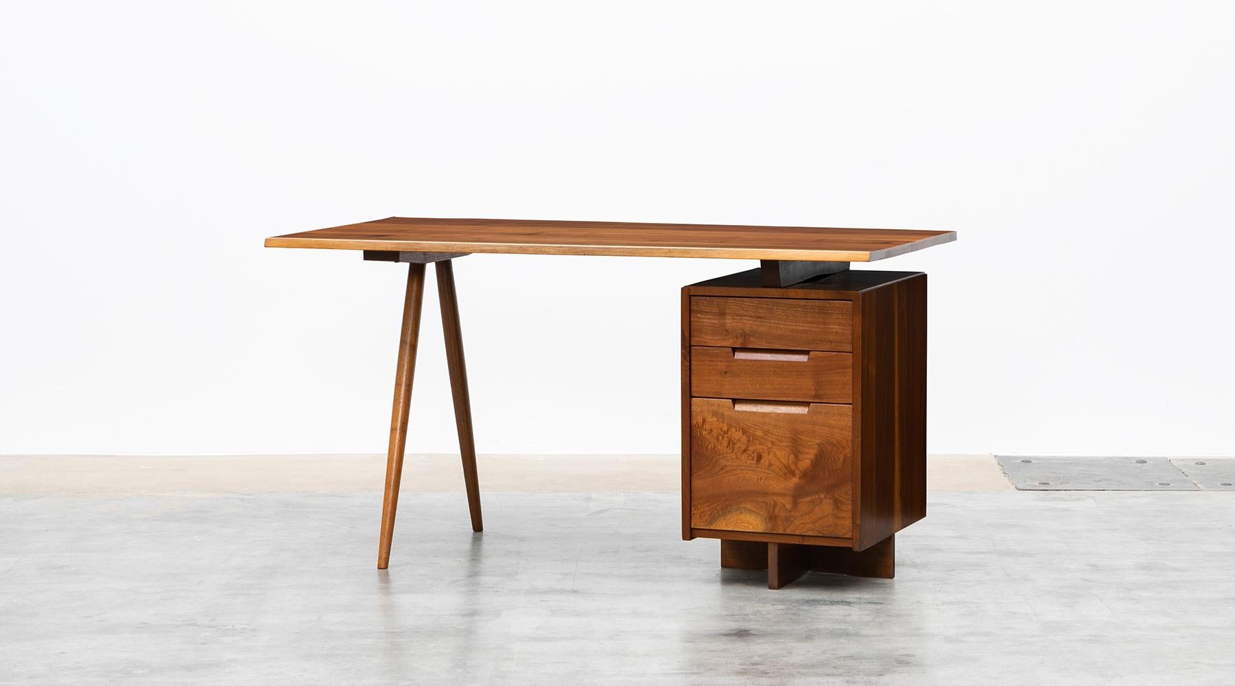 Desk by George Nakashima, American walnut, USA, 1950s.

Handcrafted, stunning, marvellous desk. This early example is constructed with American walnut with handwork by George Nakashima himself. This handcrafted desk has a beautifully shaped