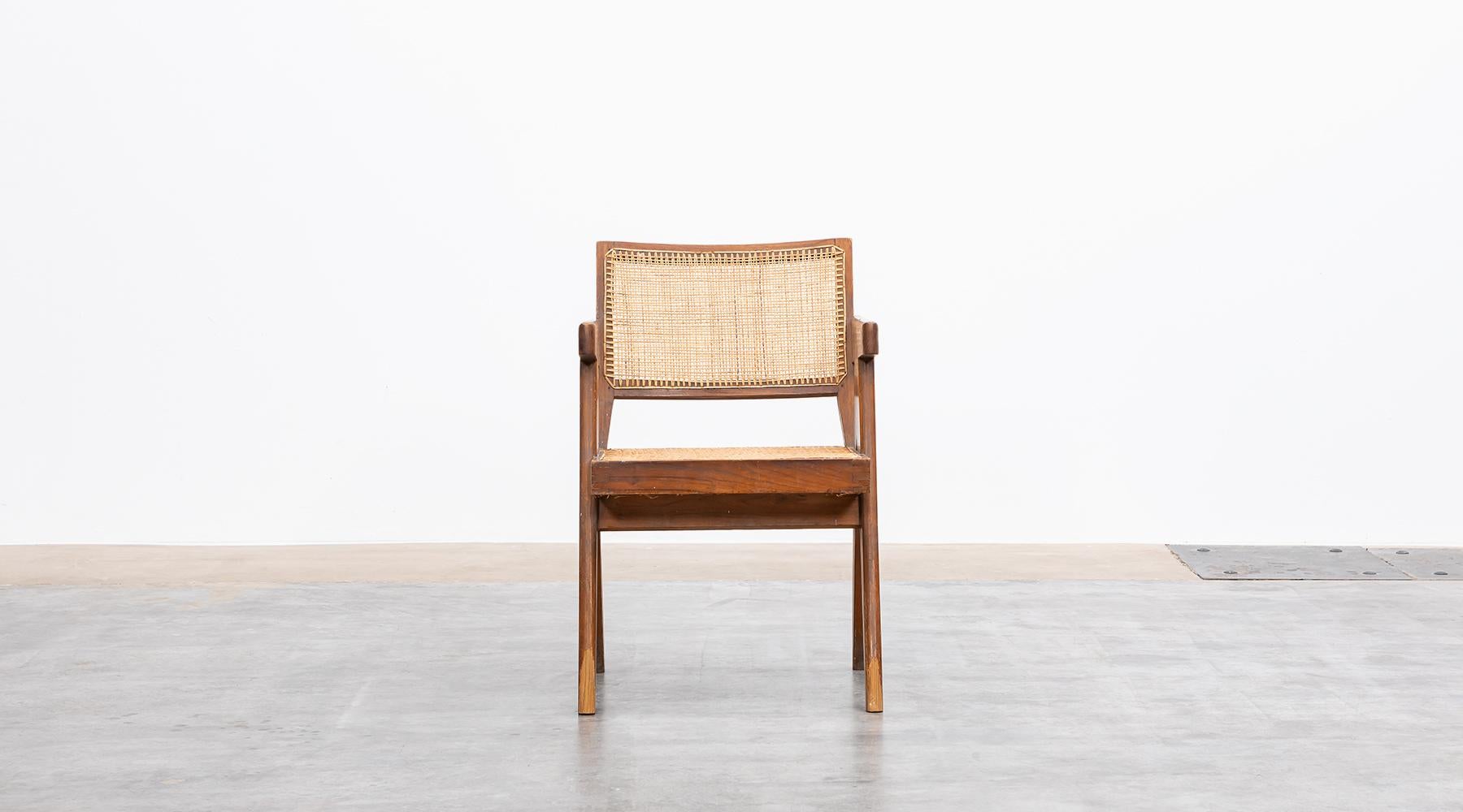 Teak and cane, Lounge chair designed by Pierre Jeanneret for Chandigarh, India, 1955.

Single original lounge chair designed by Pierre Jeanneret in teak with woven cane on the seat and curved backrest appears in beautiful patina. The chair has a