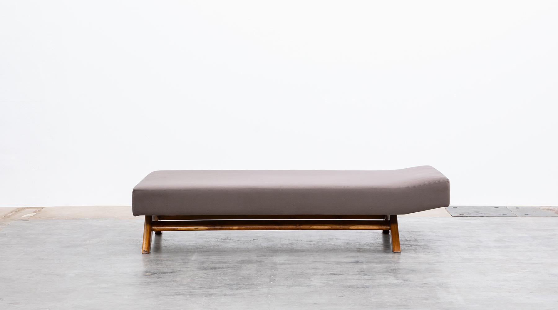 Teak and upholstery, Daybed designed by Pierre Jeanneret for Chandigarh, India, 1955.

Single original Daybed by Pierre Jeanneret. This piece comes with a slight back rise and stands on a wooden frame the sides diverge in an A-shape from the