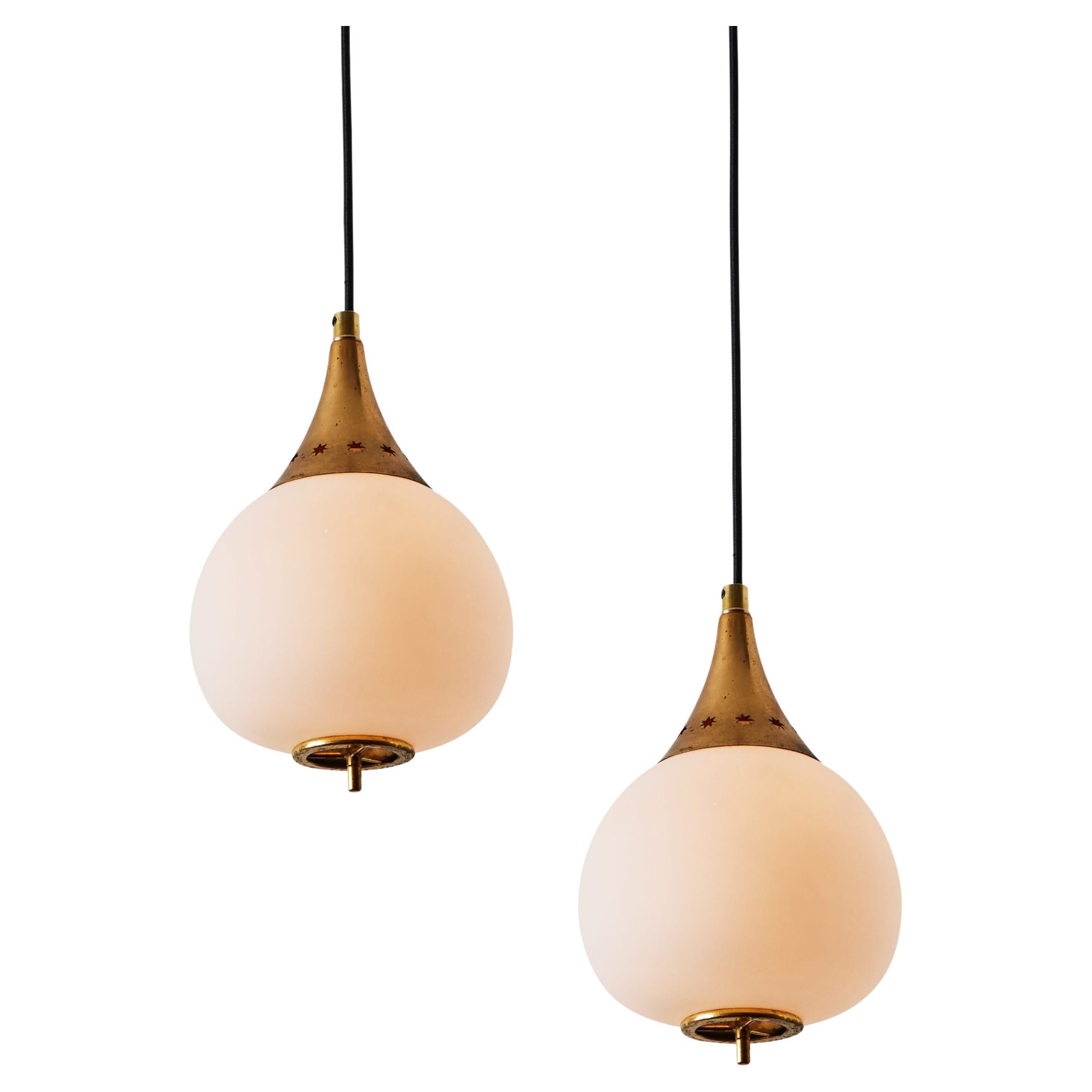 1950s Bruno Gatta Brass and Opaline Glass Pendant for Stilnovo. A quintessentially 1950s Italian design executed in matte finish opaline glass with attractively patinated sculptural brass hardware. A highly functional light sculpture of incomparable