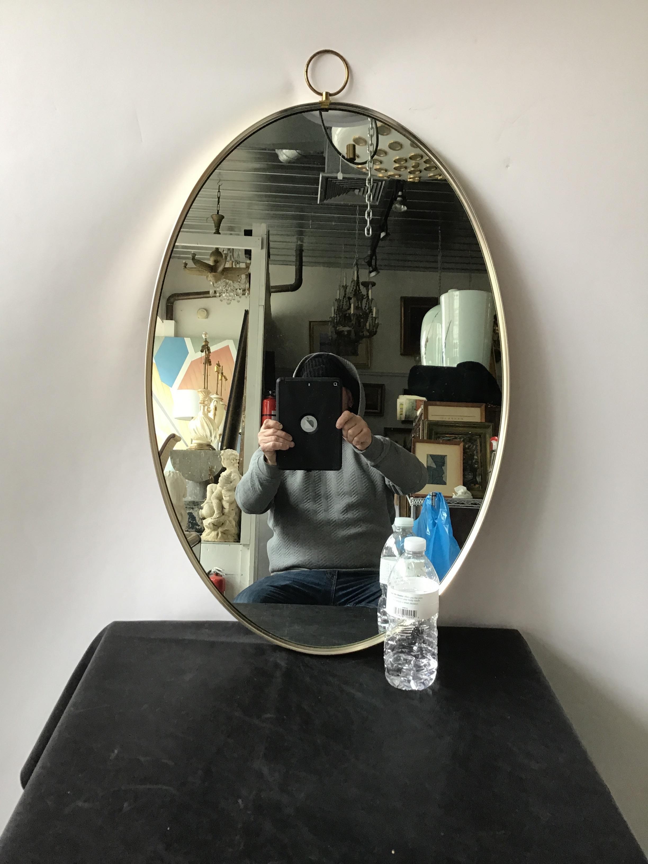 1950s brushed steel oval mirror by Turner.