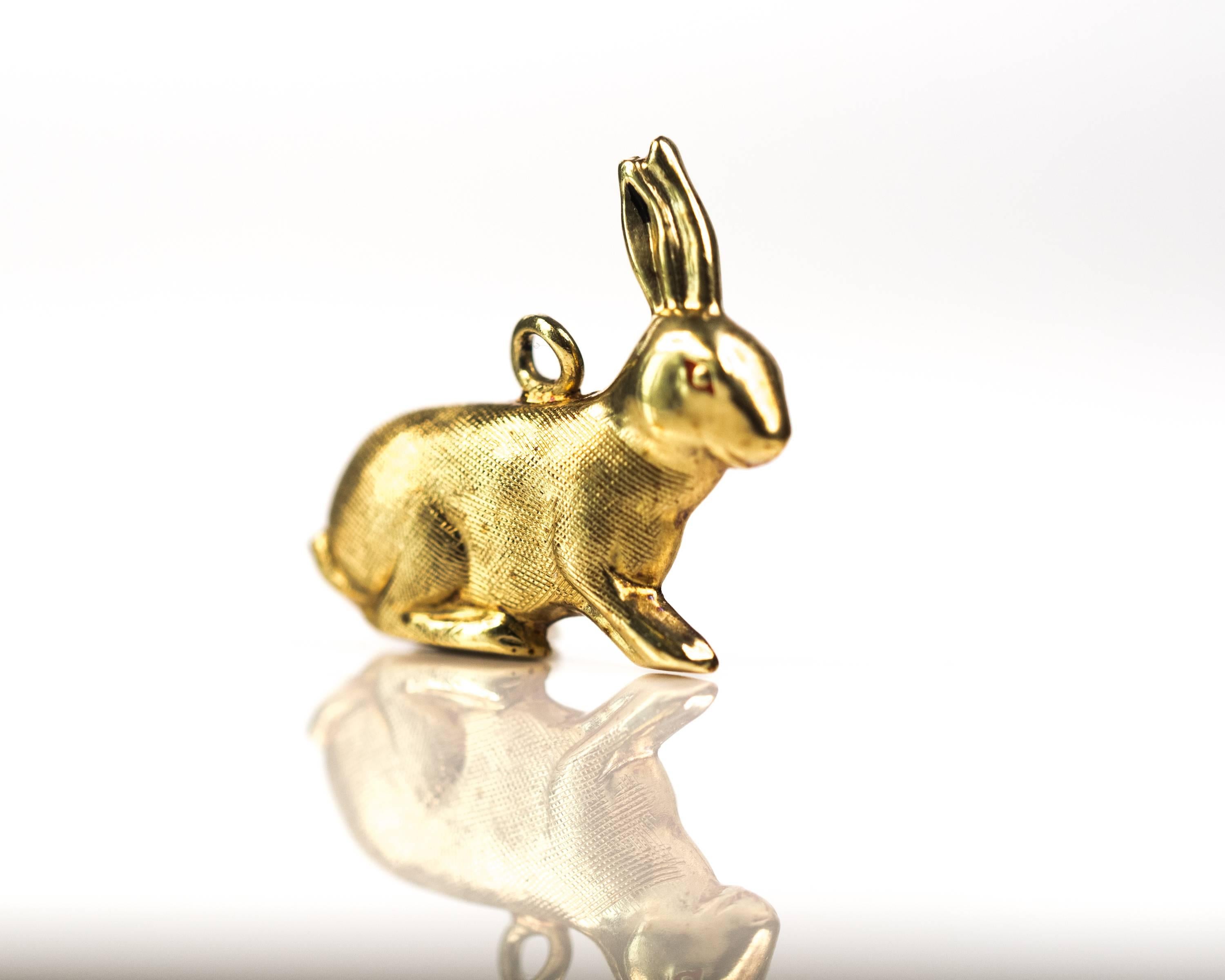 1950s Bunny Rabbit Charm - 14 Karat Yellow Gold

This 14 Karat Yellow Gold Bunny Rabbit is in a sitting position. 2 erect ears are positioned at the top of the head. The face is detailed with 2 eyes, nostrils and a tiny mouth. One eye has red enamel