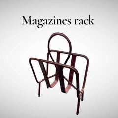 1950's Burgundy stitched leather magazine rack by Jacques Adnet